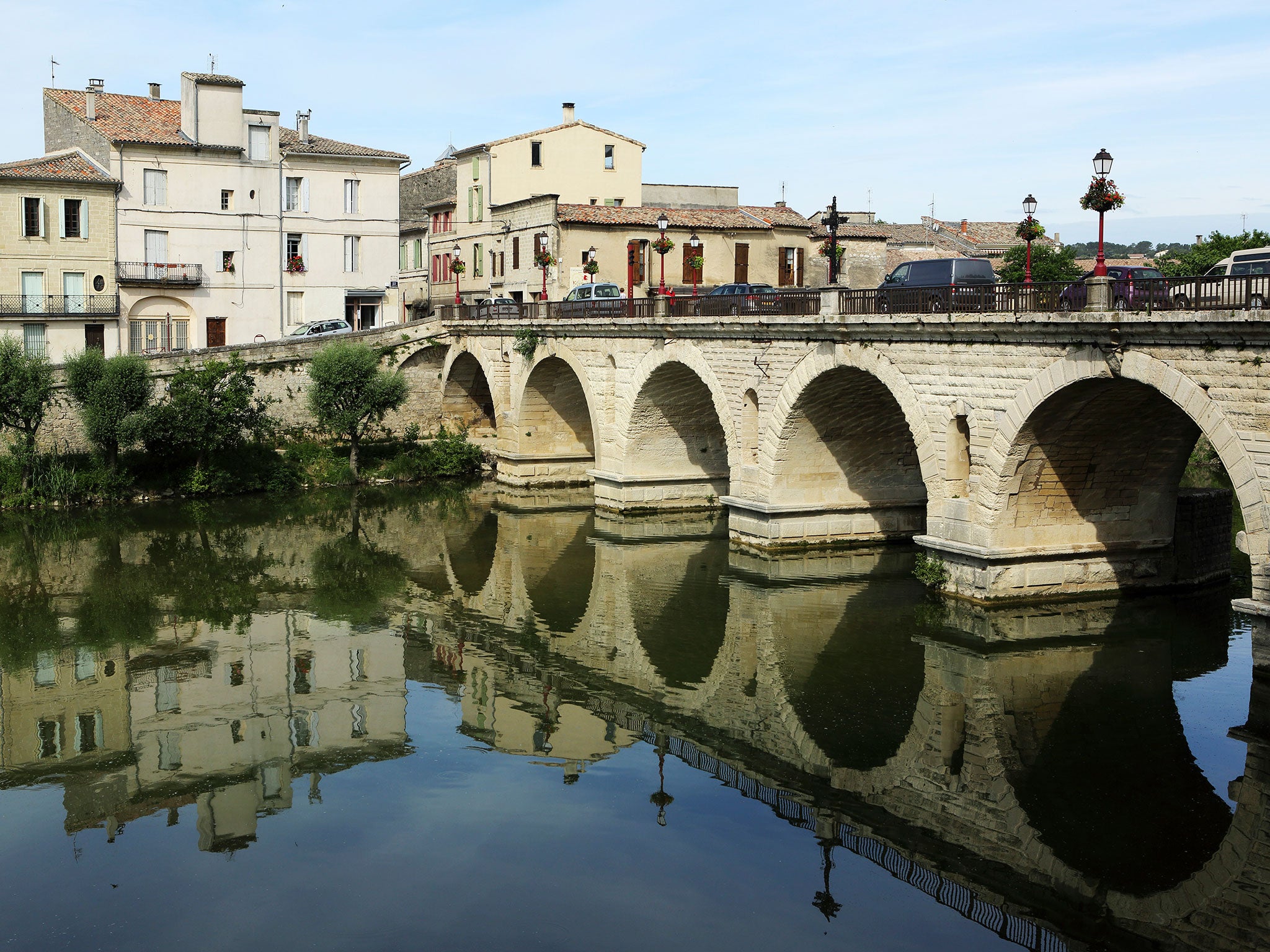 The Roman Bridge crosses the River Vidourle in Sommieres, France