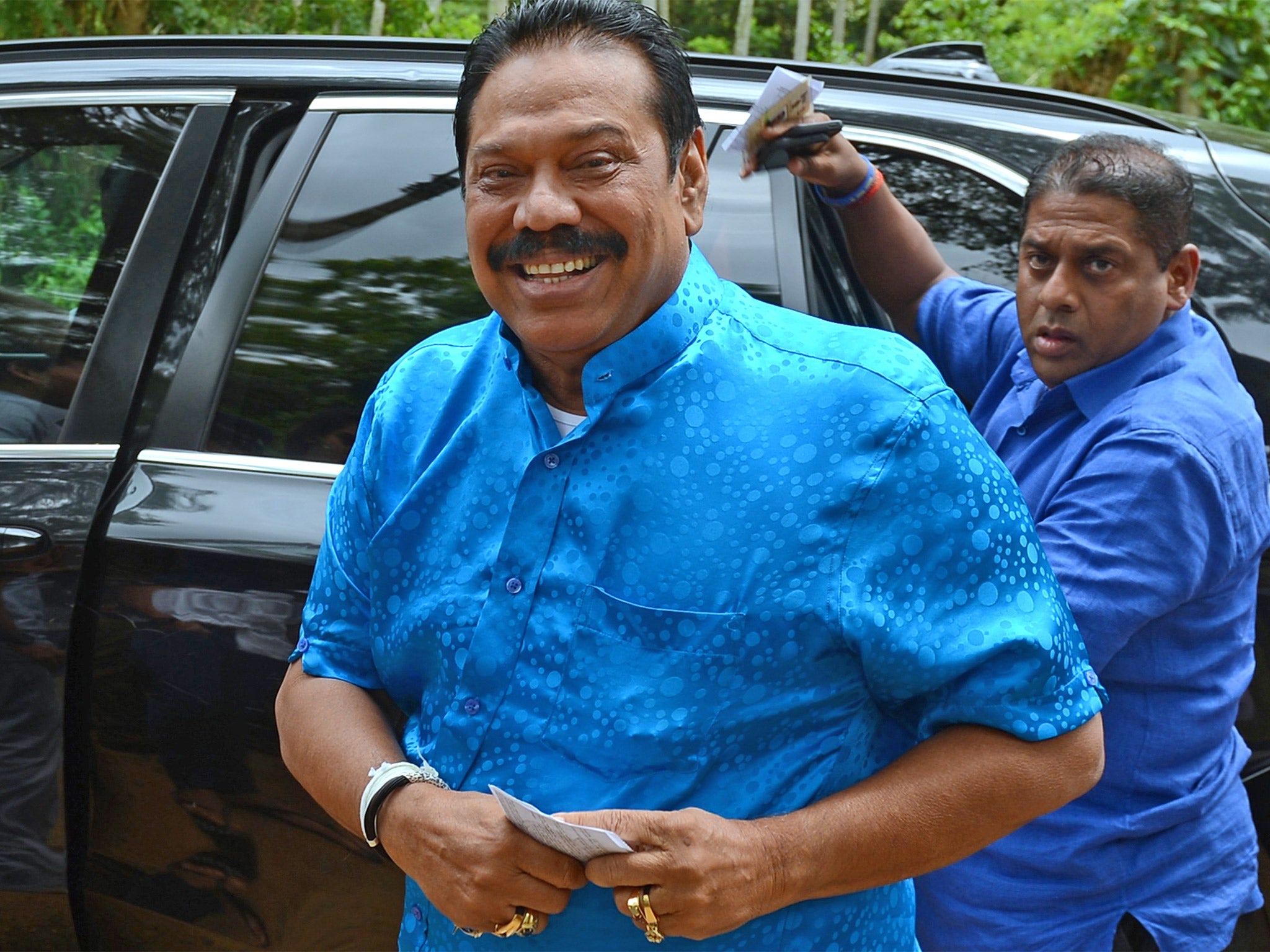 Defeated: former President Mahinda Rajapakse at a polling station in his native town of Tangalla, on Monday (Getty)