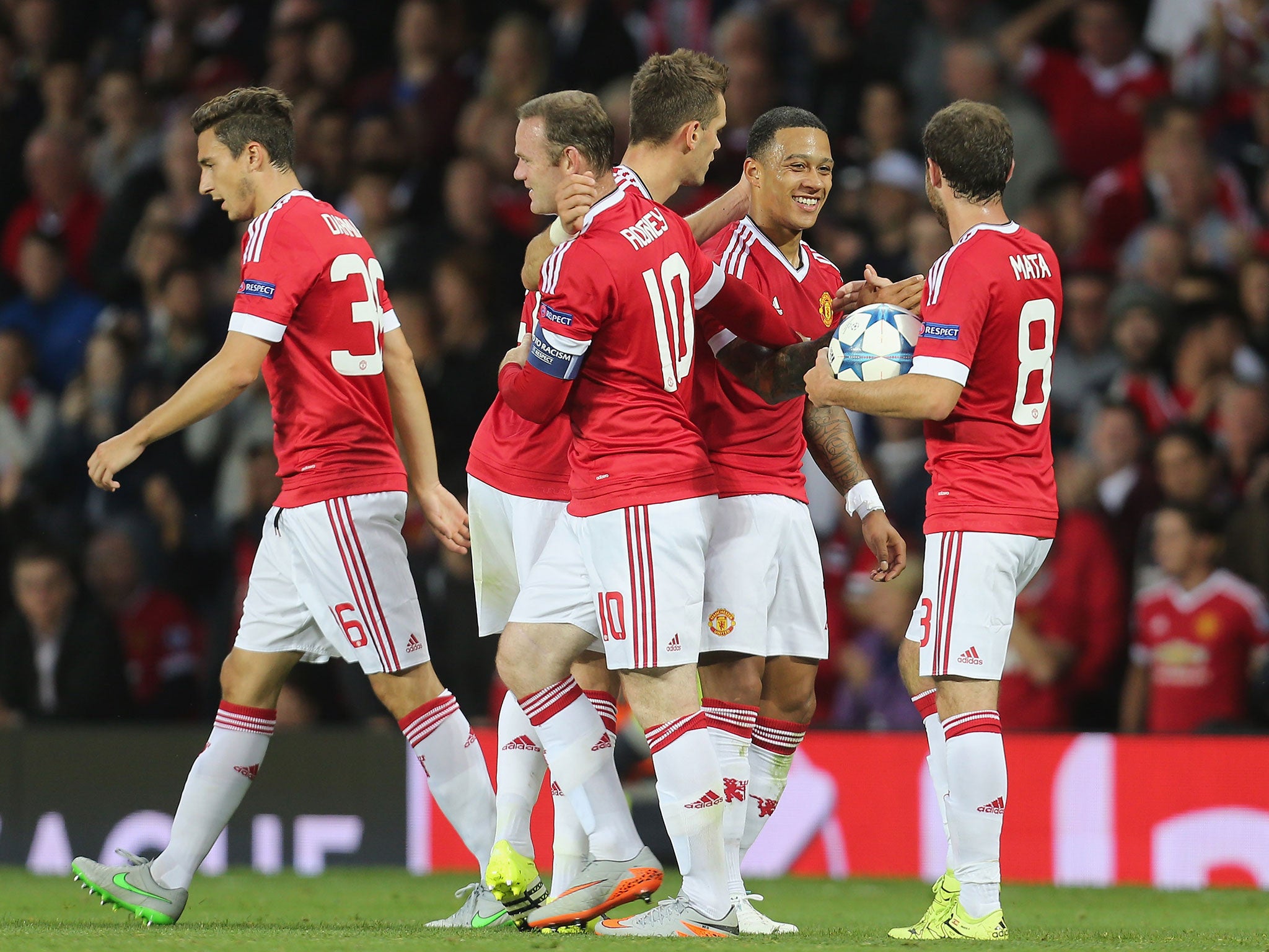 Memphis Depay celebrates one of his goals against in last week's first leg (Getty)