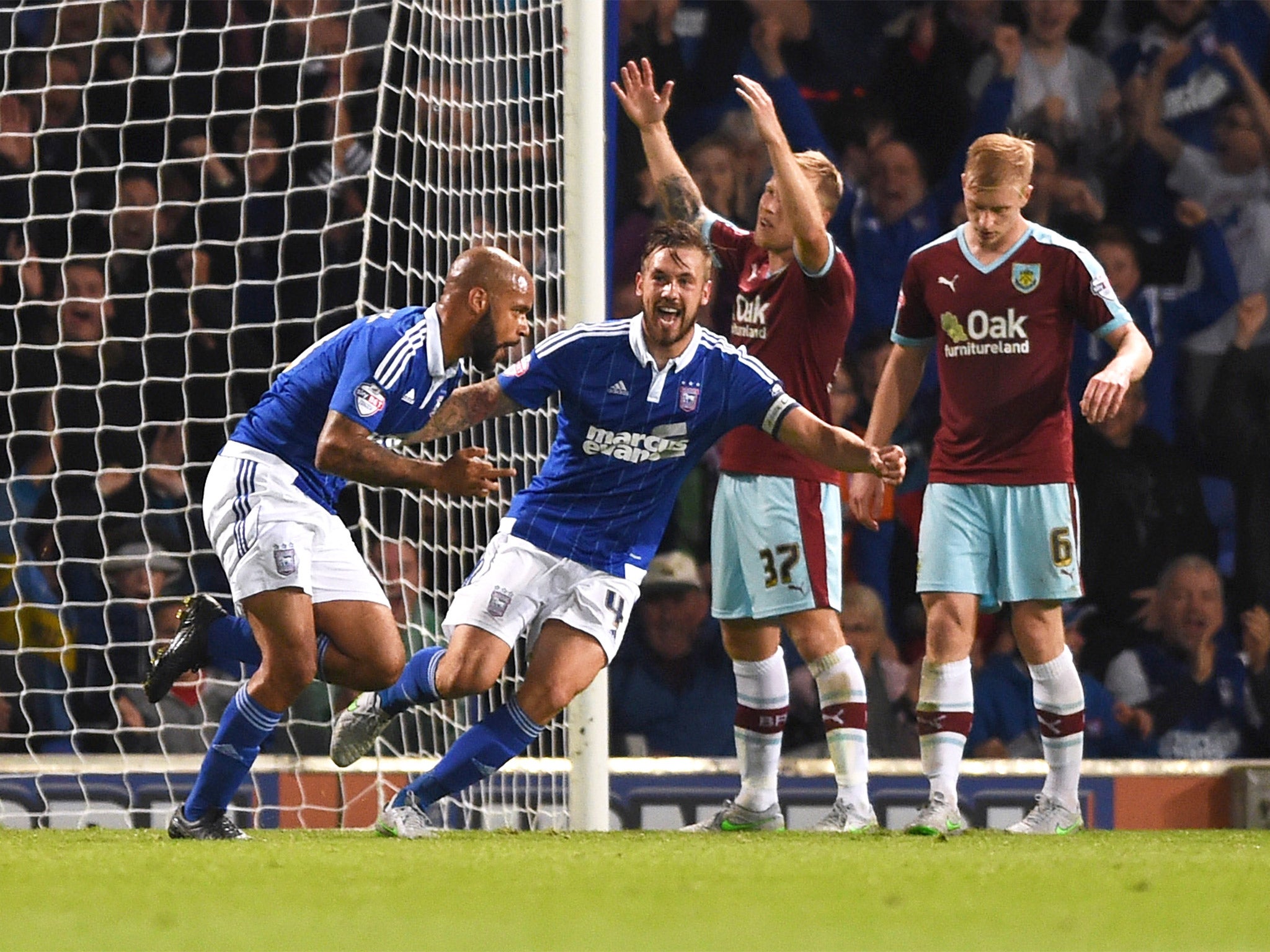 David McGoldrick, left, celebrates scoring Ipswich's second goal with Luke Chambers