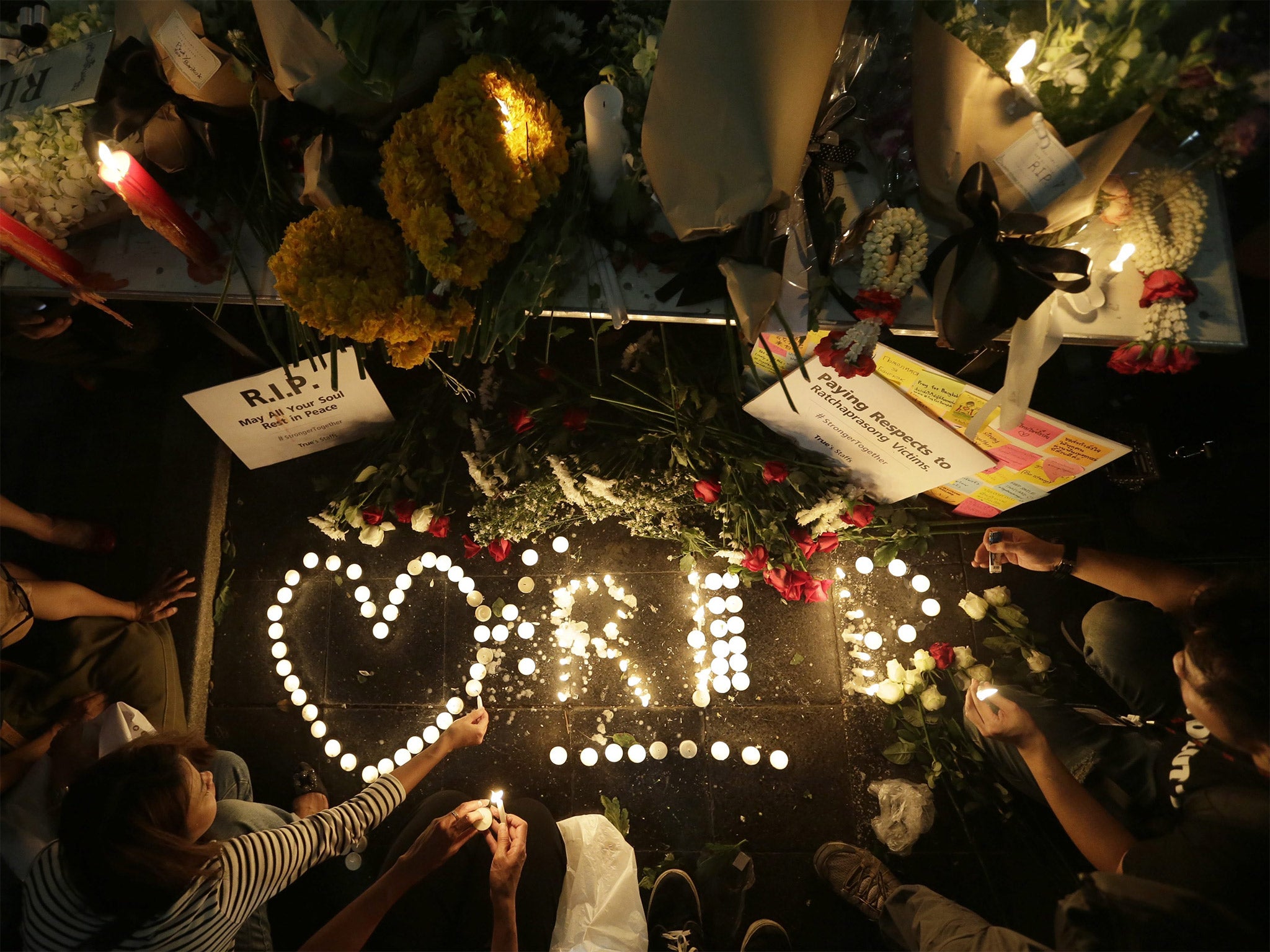 Tributes: candles and flowers in central Bangkok