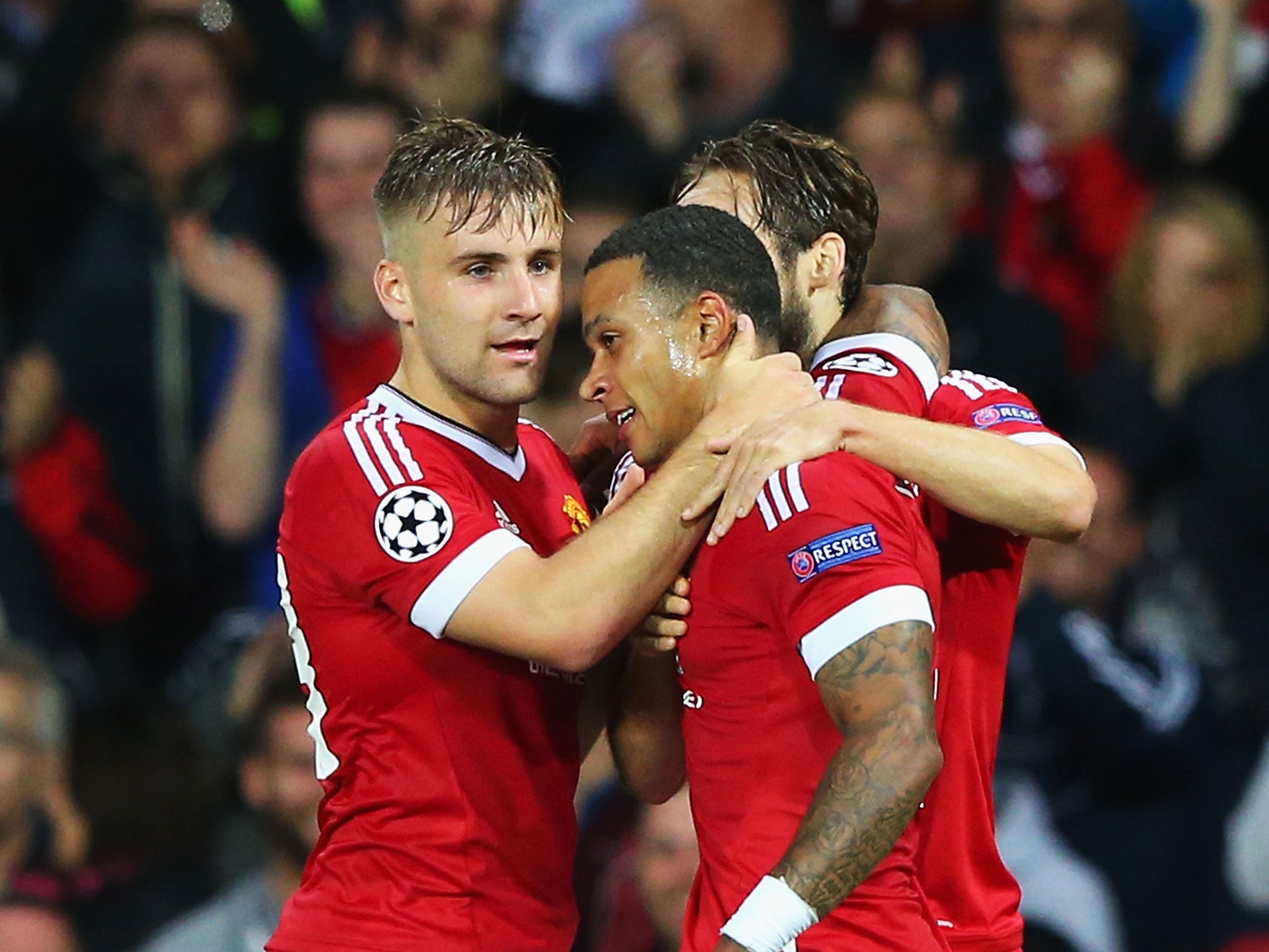 Memphis Depay celebrates his second goal with Luke Shaw