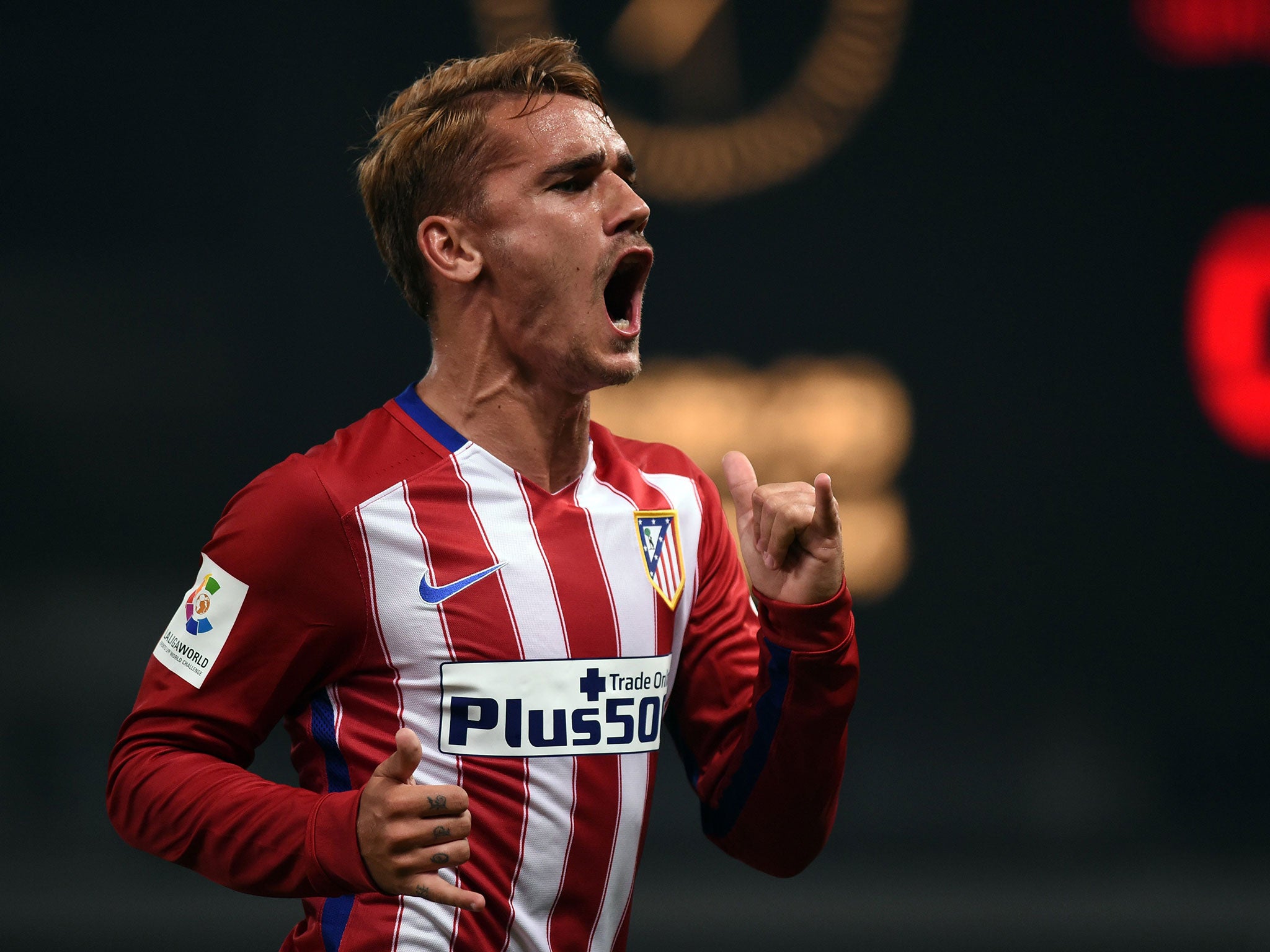 Antoine Griezmann celebrates scoring for Atletico Madrid