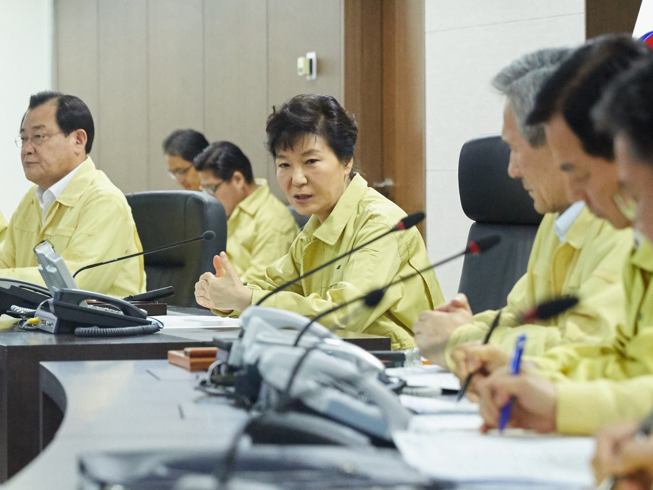 South Korean President Park Geun-Hye (C) presides over an emergency National Security Council session on North Korea's rocket firing at the presidential Blue House in Seoul on August 20, 2015.