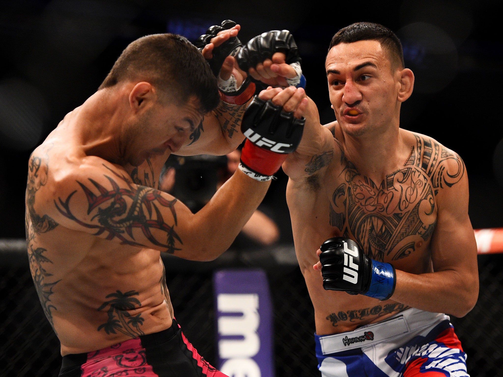 Max Holloway punches Cub Swanson