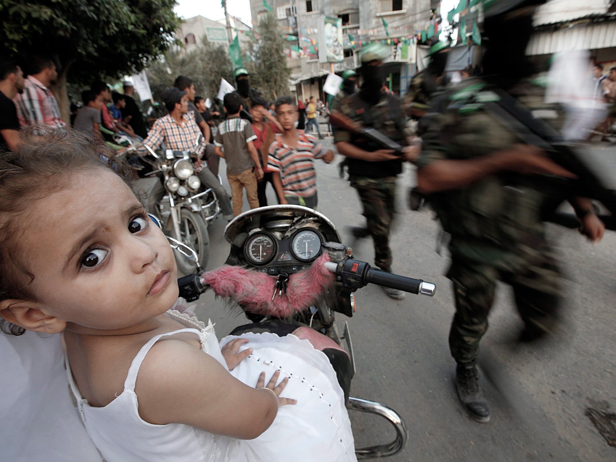 Hamas militants parade in Gaza, which has been blockaded since Hamas took power in 2007