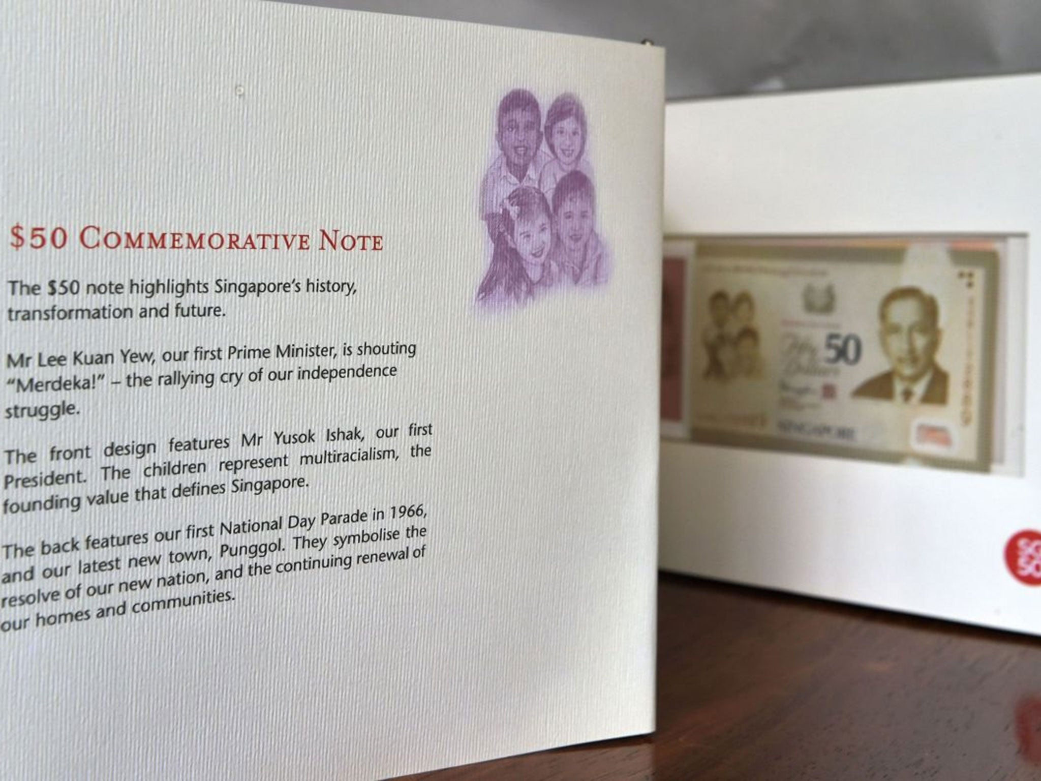 A misspelling of Singapore's first president "Yusok Ishak" (third paragraph) on a folder kit of the 50 Singapore dollar commemorative note (Image: AFP)