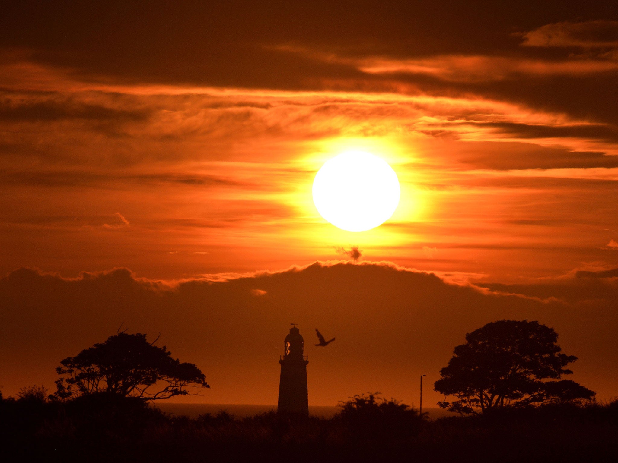 The sun rises over Whitley Bay, as hot and humid air is expected to be pushed into northern Europe this weekend, including Britain, creating a "Spanish Plume"