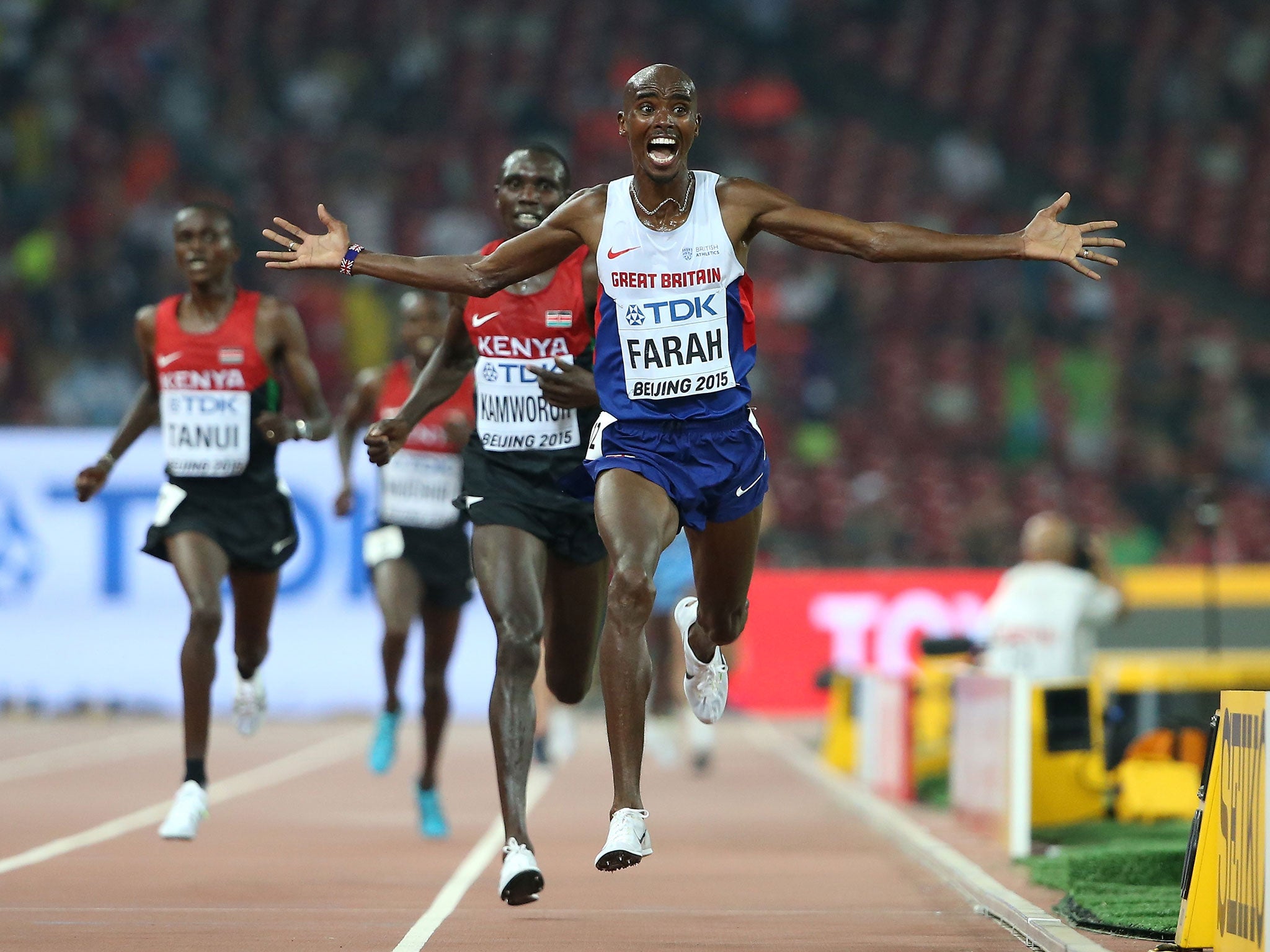 Mo Farah celebrates as he crosses the finish line to win World Championship 10,000m gold