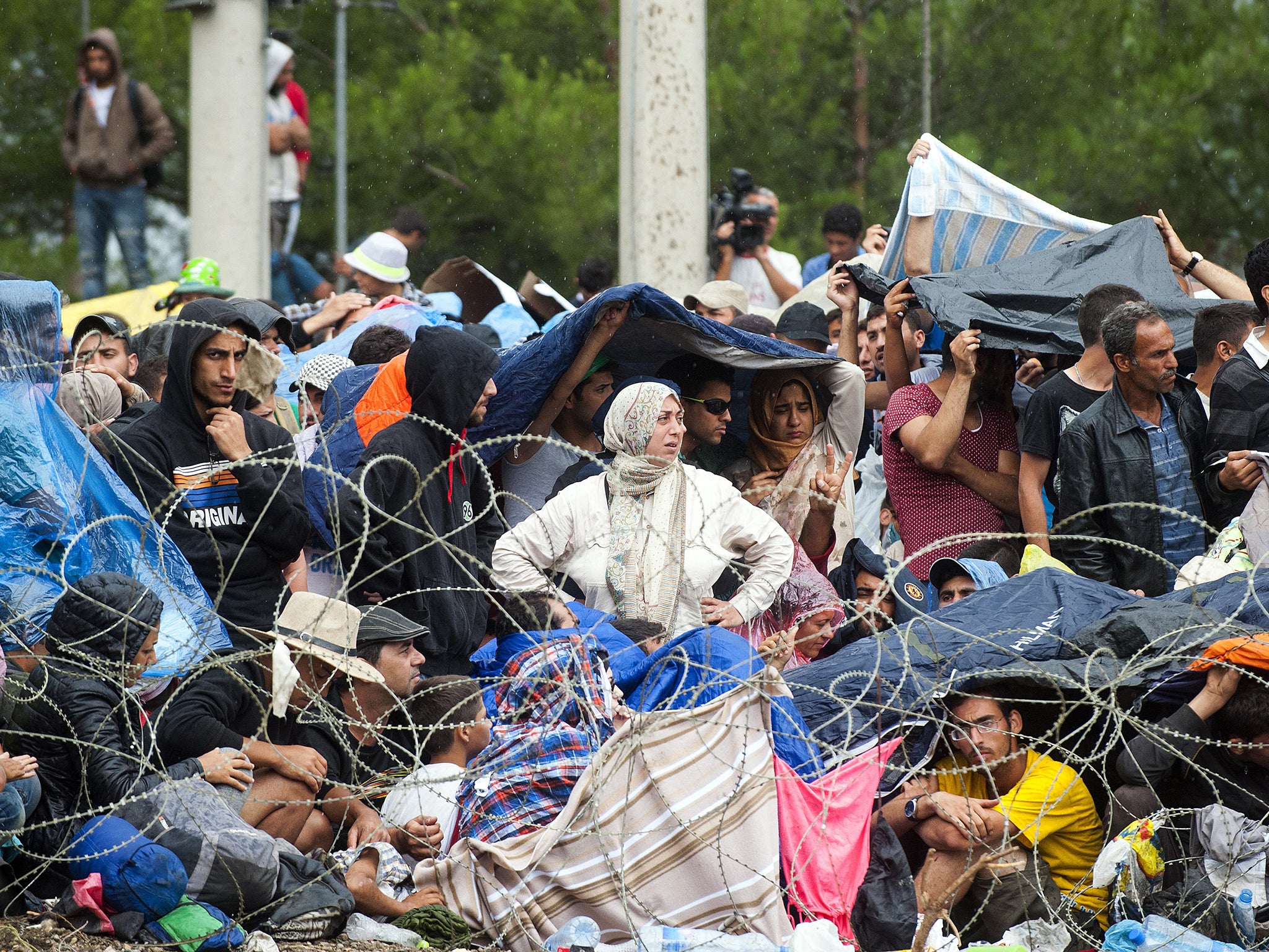 Refugees, mostly Syrian, on the border of Greece and Macedonia last week