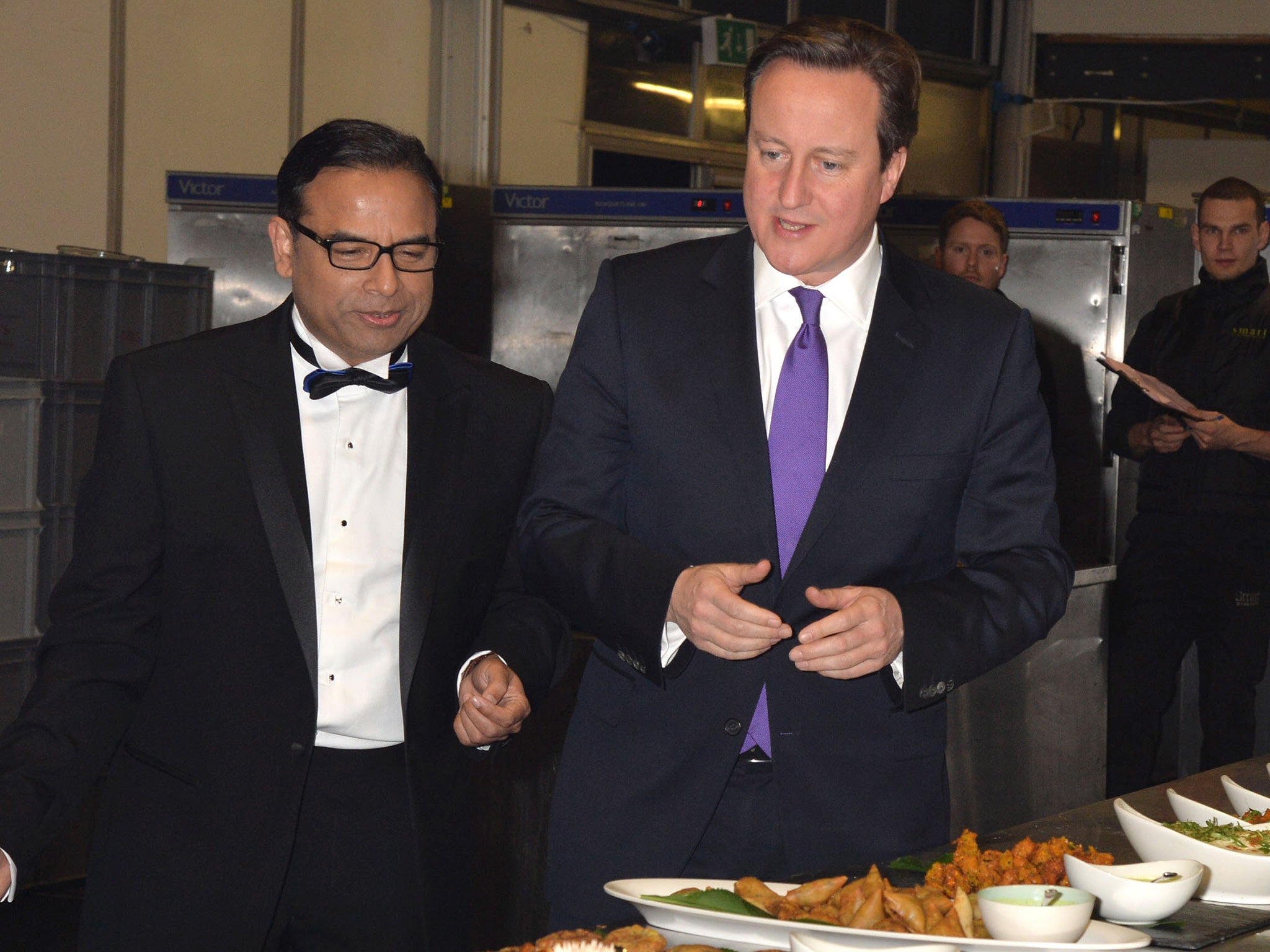 David Cameron inspecting curries with Enam Ali