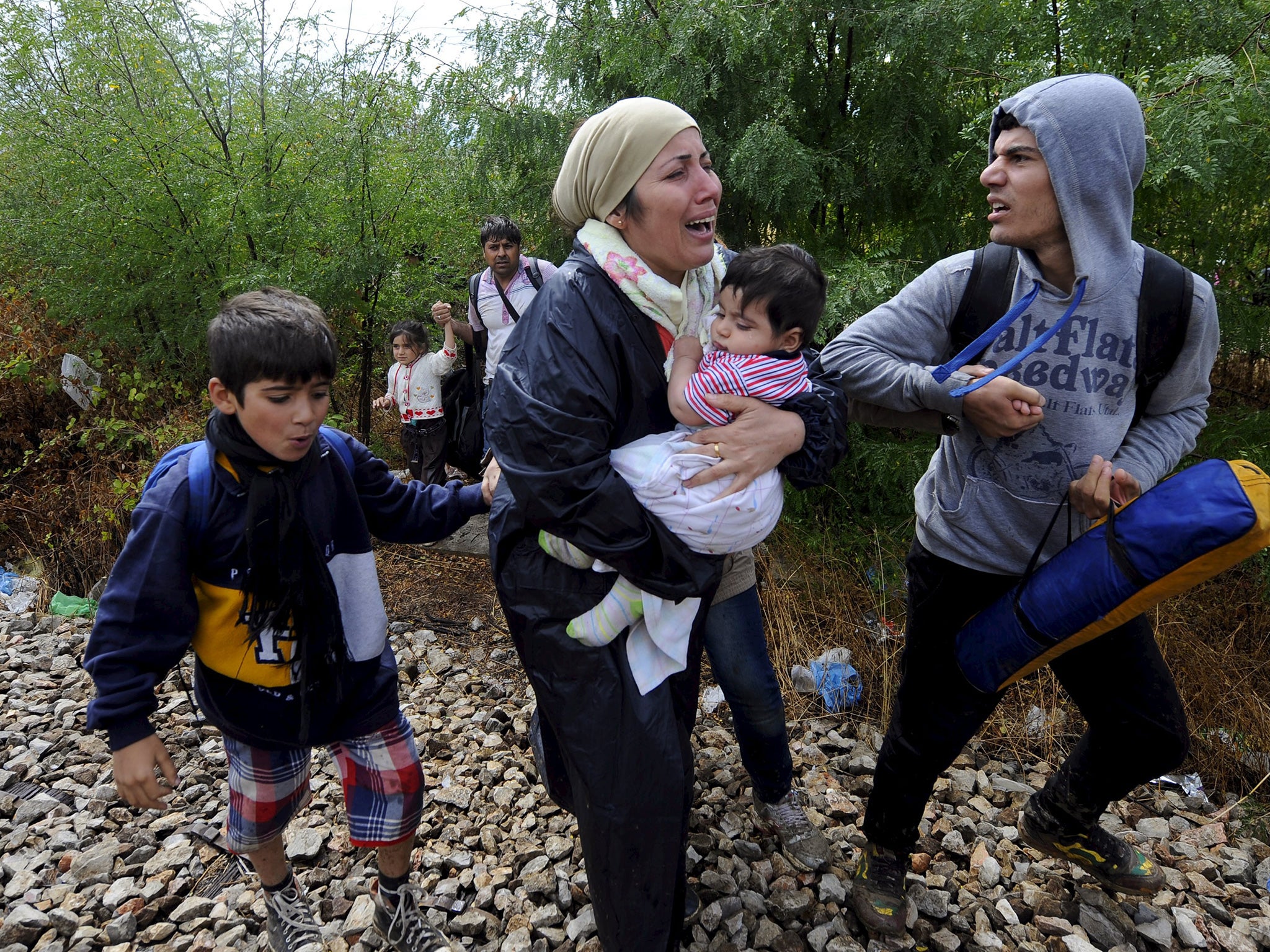 A Syrian family fleeing their war-torn country, just some of four million Syrians who have fled since civil war broke out in 2011