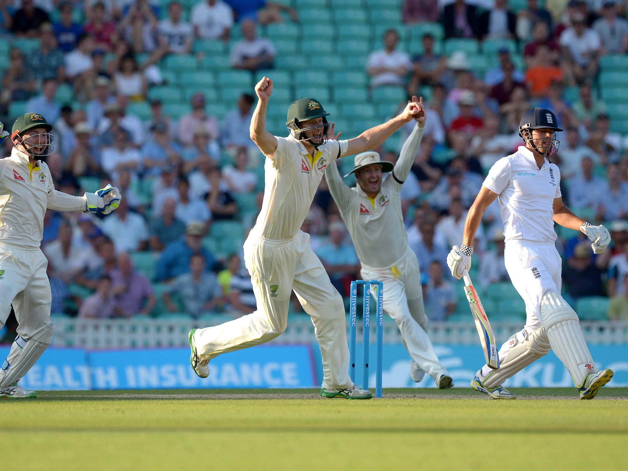 Australia celebrate as England captain Alastair Cook is dismissed by the part-time leg spin of Steve Smith