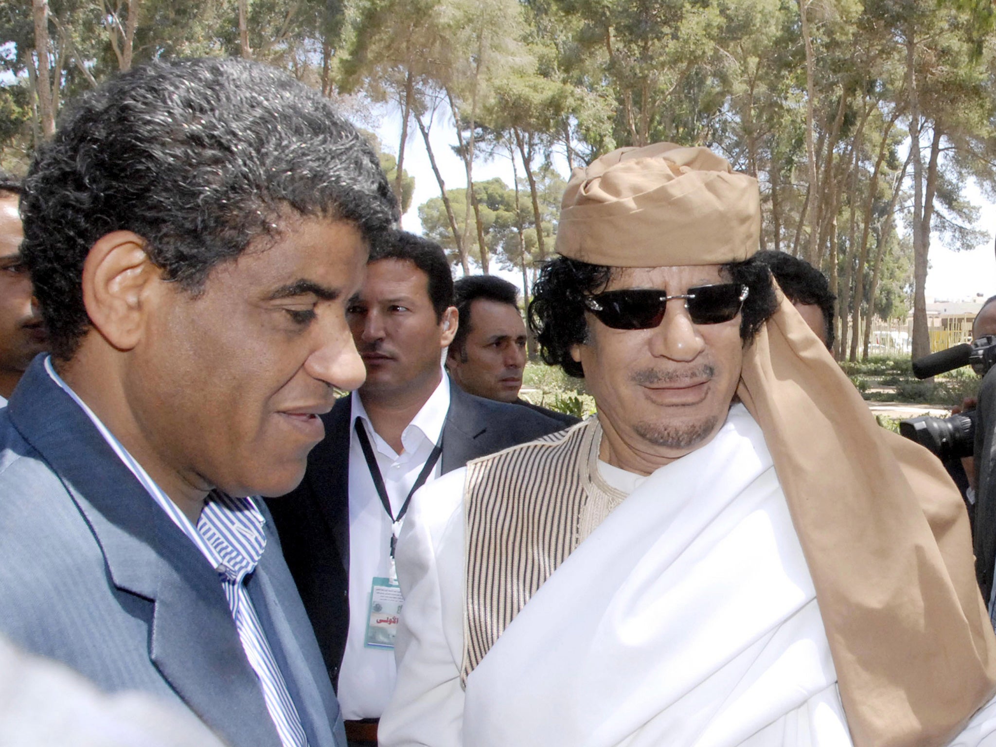 Abdullah al-Senussi on the left with Gaddafi