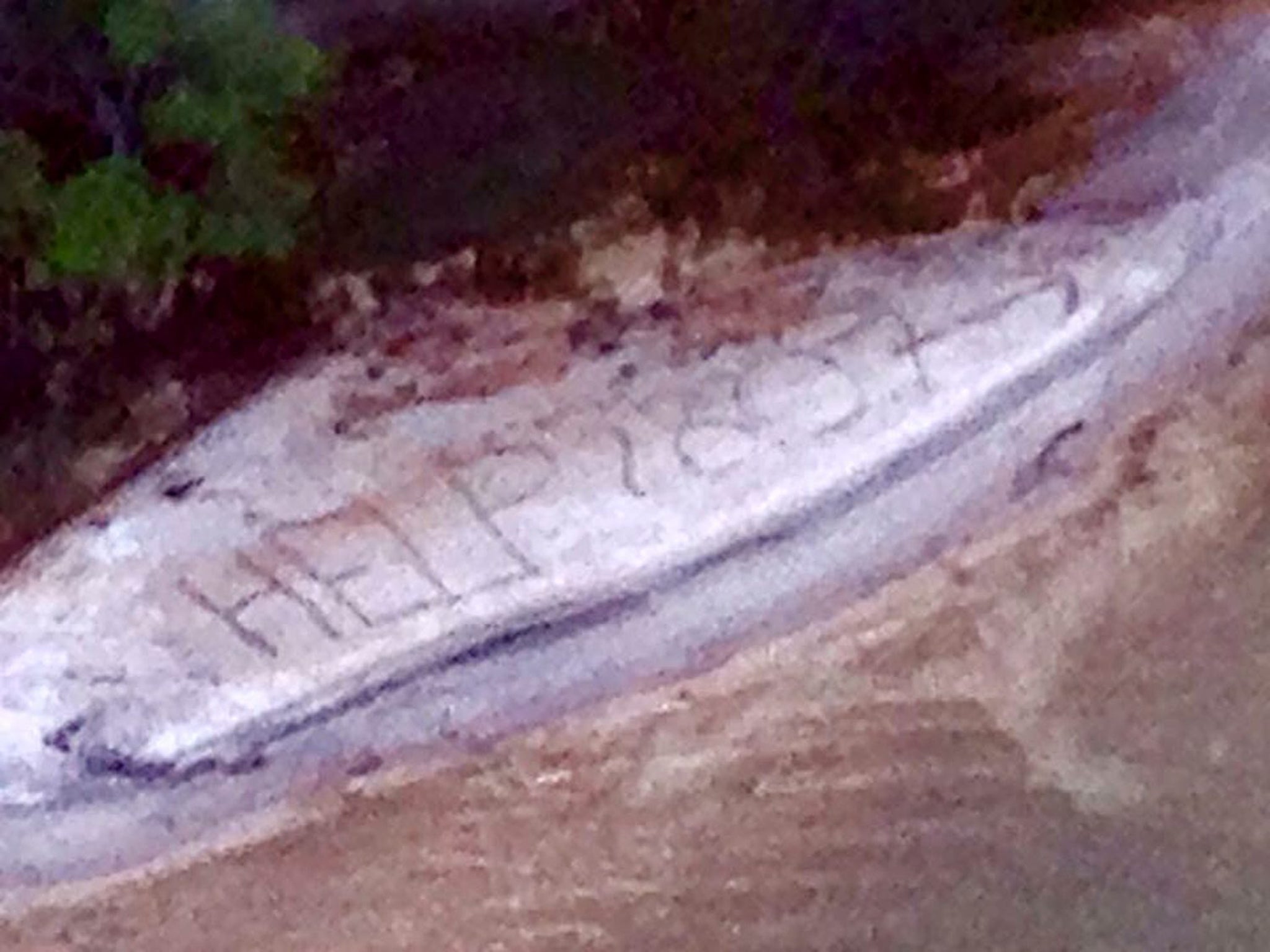 Mr Keys carved the SOS message 'HELP 2807' with an arrow pointing downstream