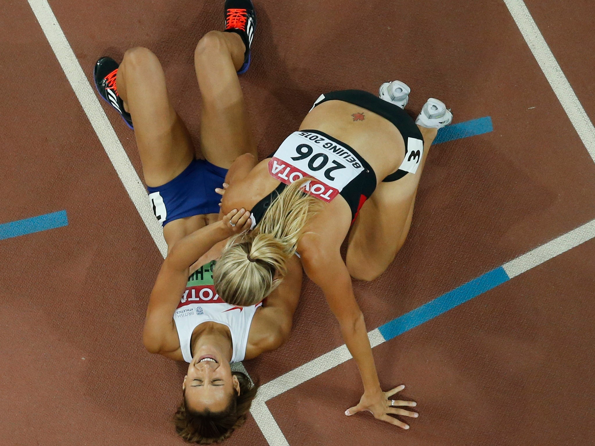 Jessica Ennis-Hill is congratulated by Canada’s silver medal winner Brianne Theisen-Eaton after her gold medal in the heptathlon (AP)