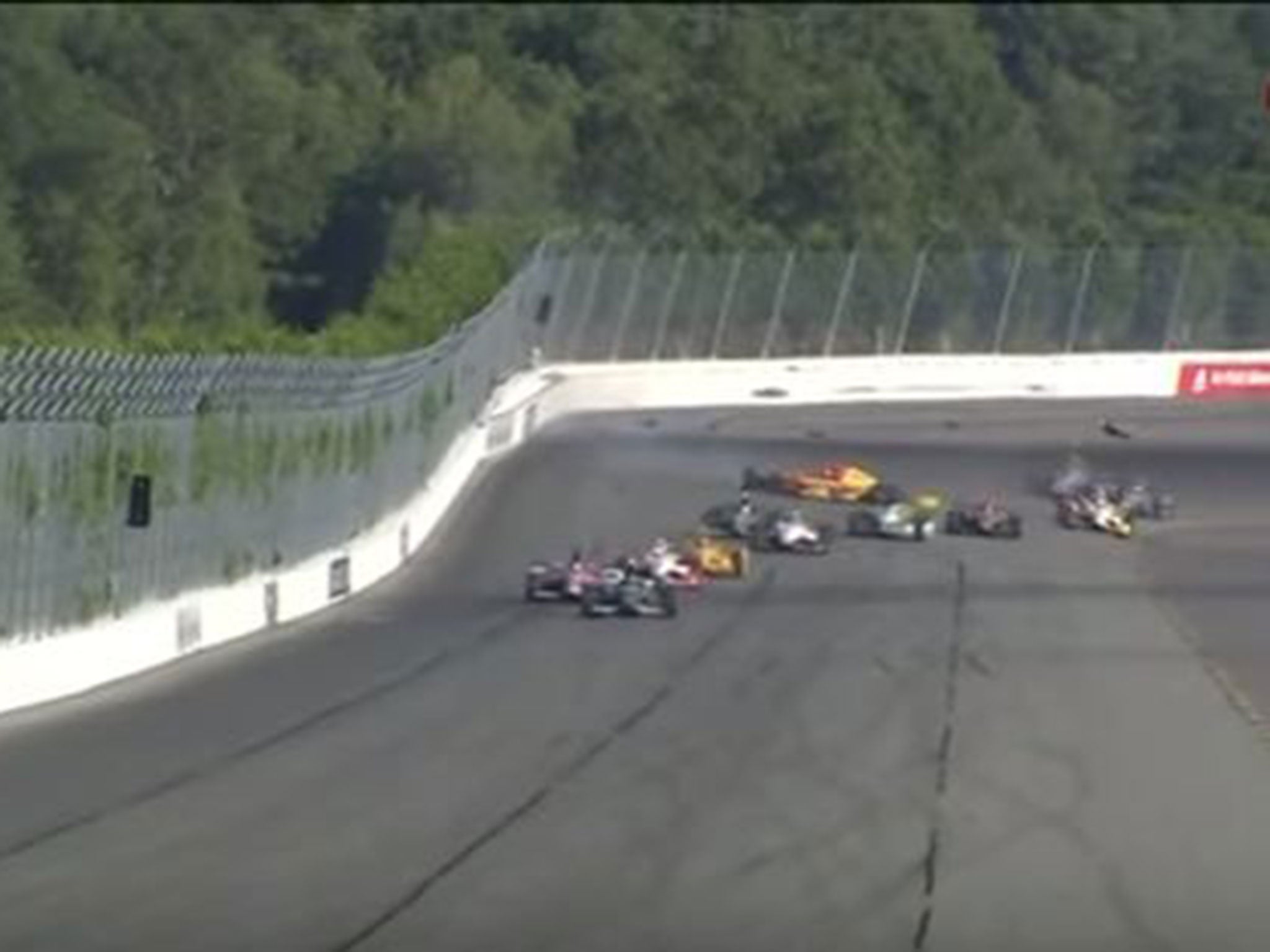 Wilson's car (top right, blue) is hit by a bit of debris from Karam's spinning vehicle (middle, yellow and red)