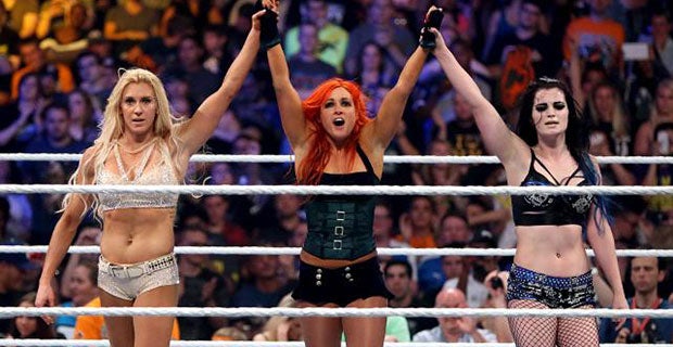 Charlotte, Becky Lynch and Paige celebrate their victory