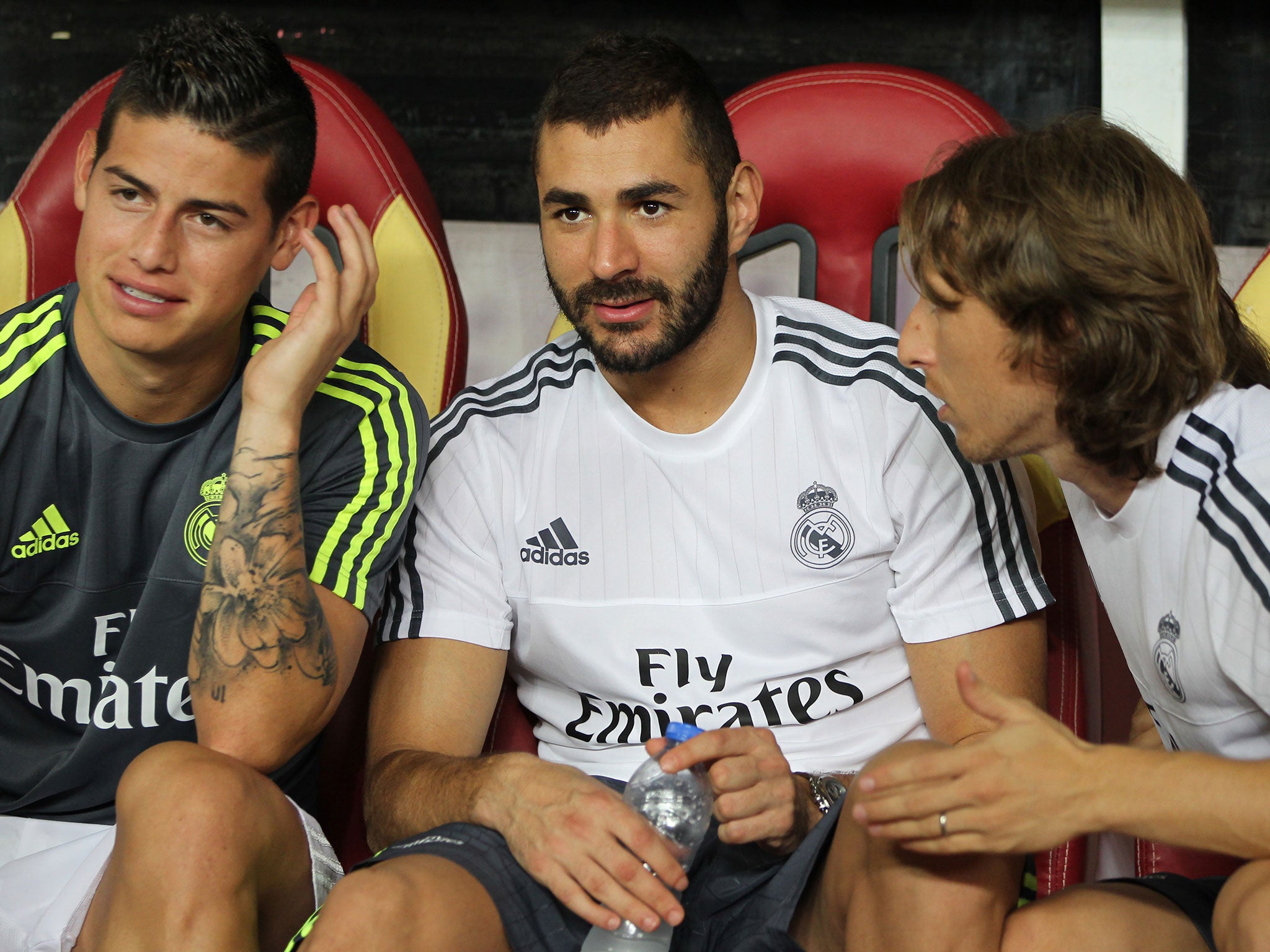 Karim Benzema with Real Madrid team-mates James Rodriguez (l) and Luka Modric