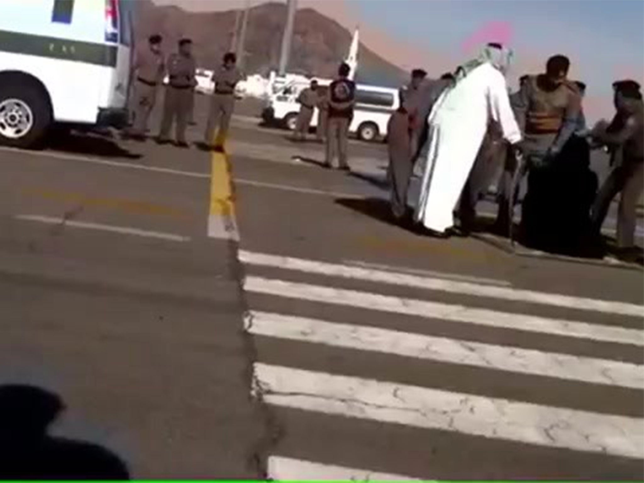 Still from a video, taken secretly by a security guard, of the execution of a Burmese woman in Saudi Arabia in Janurary 2015