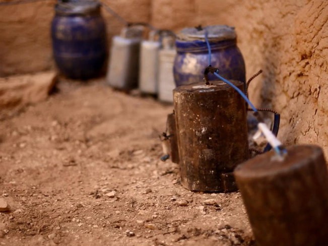 Images show explosives wired together both inside and outside the temple