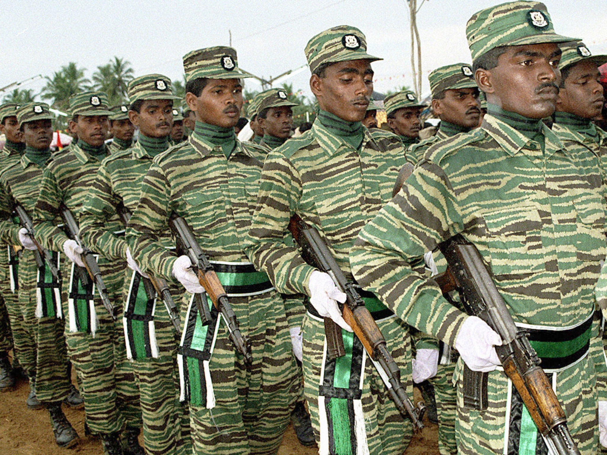 Tamil Tiger guerrillas take part in a military parade in 2003 (Getty)