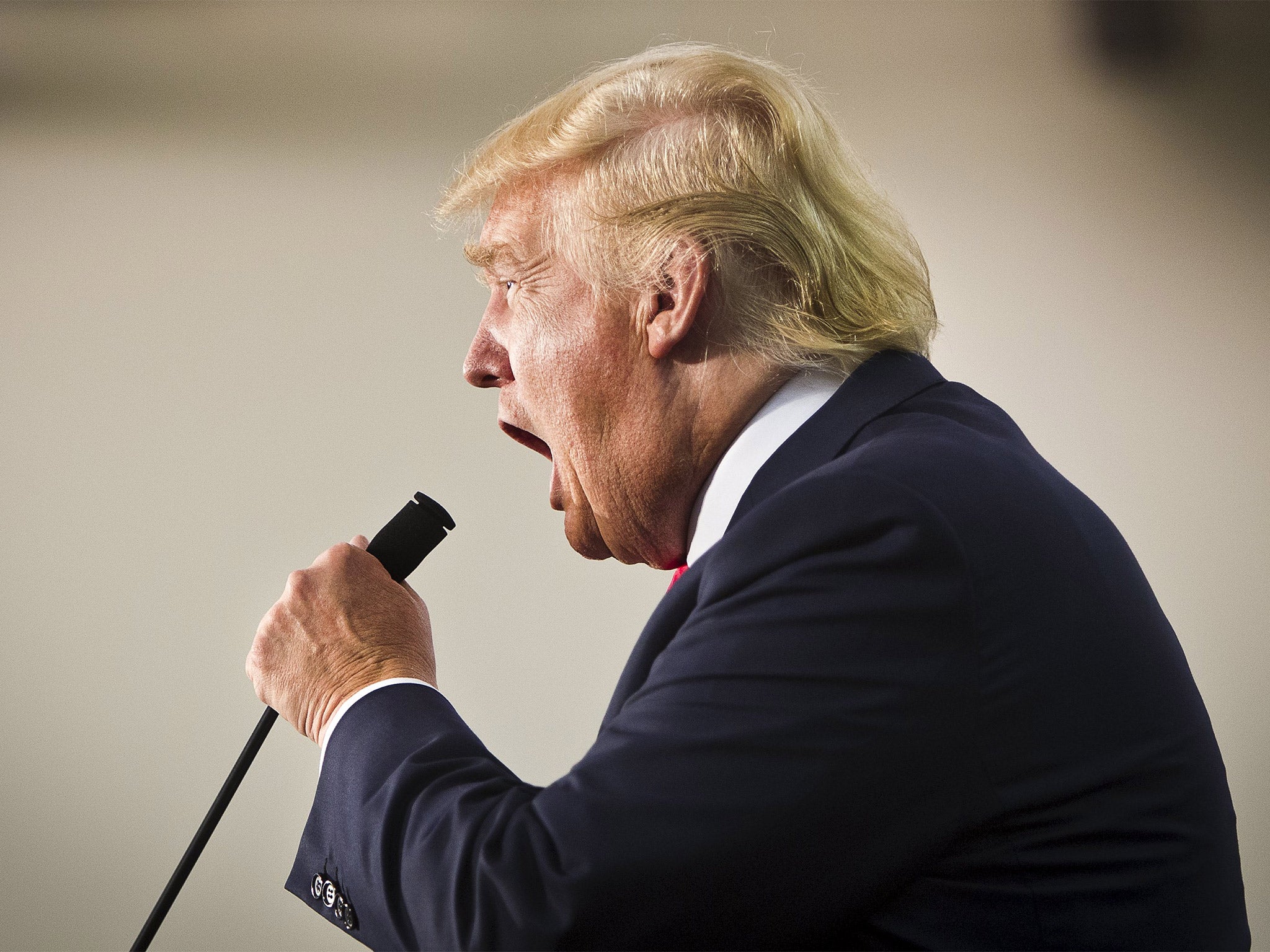 Donald Trump's greets the crowd during his 'Make America Great Again Rally' at the Grand River Center in Dubuque, Iowa