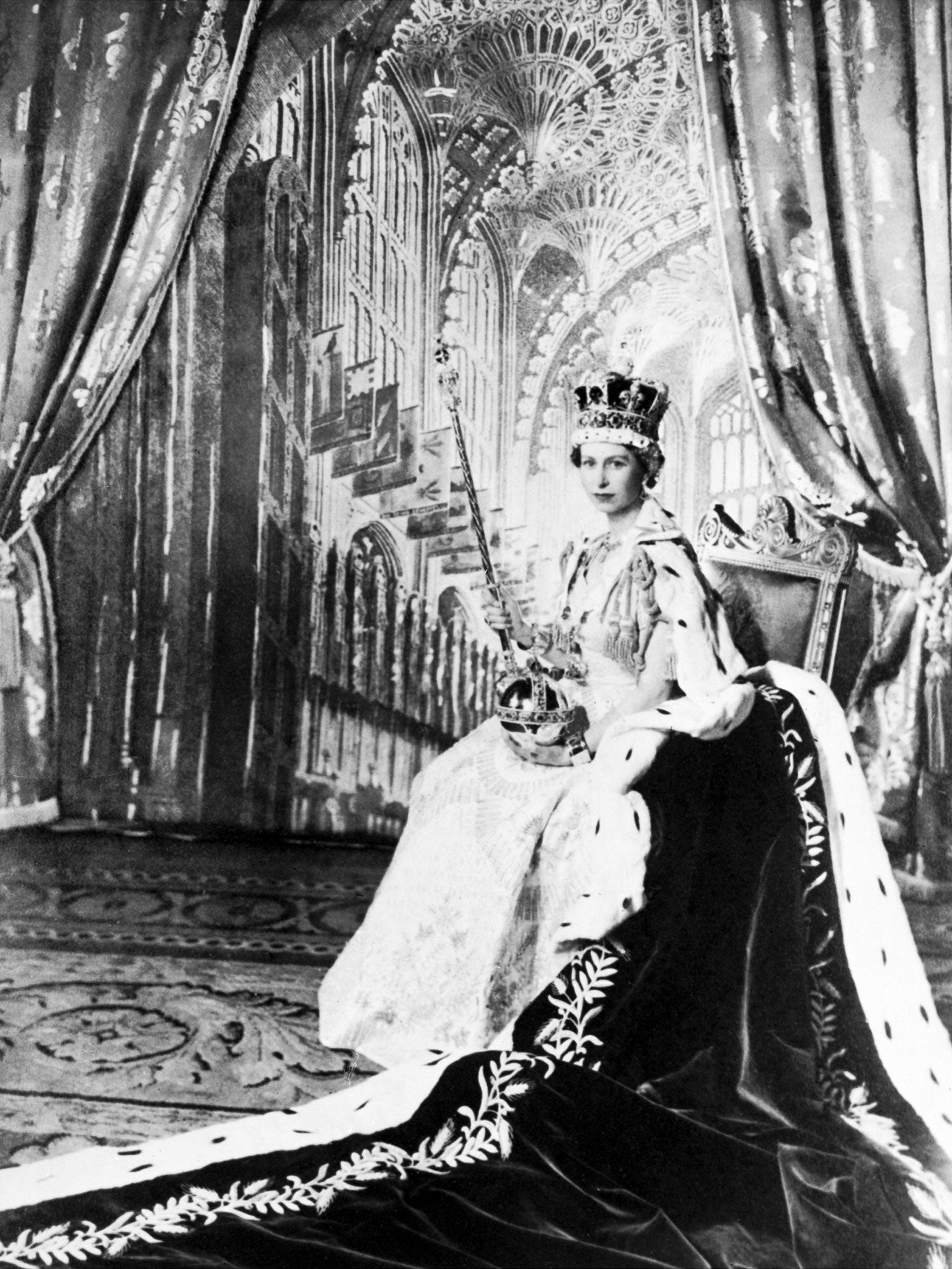 Queen Elizabeth II poses with the royal sceptre 2 June 1953 after being crowned at Westminter Abbey in London (Image: Getty)