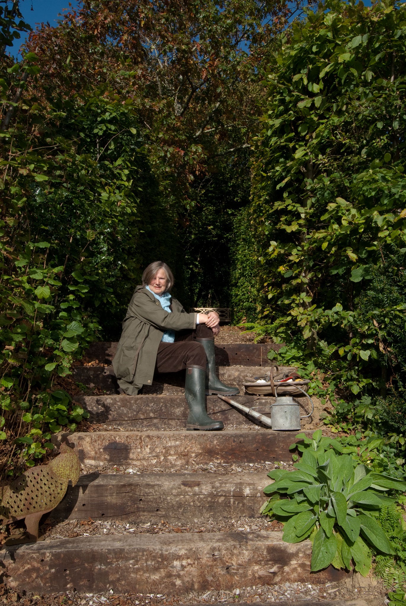 Anna Pavord takes a break in her garden