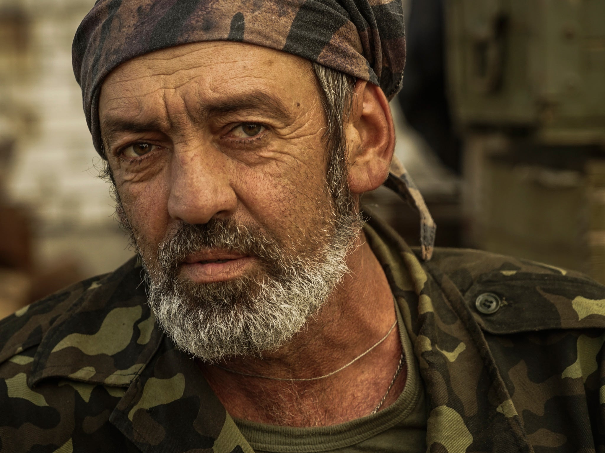 Ukrainian government soldier poses for a photo at his positions near Avdiivka, 24th August 2015