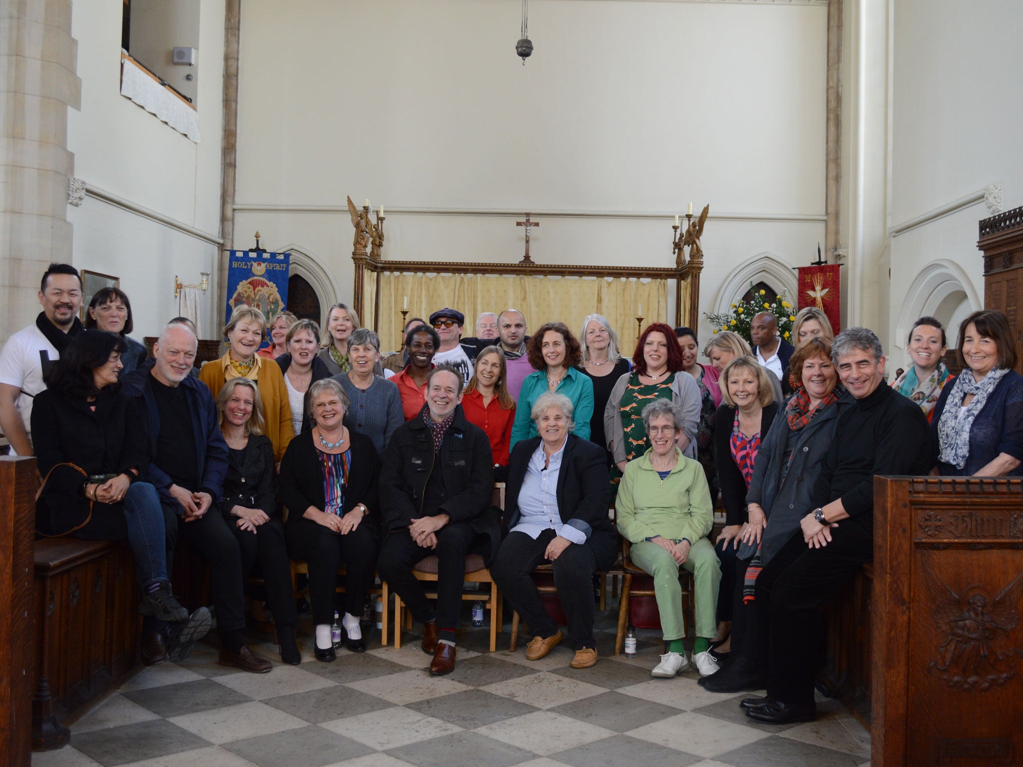 The Liberty Choir with David Gilmour front row second left and his wife Polly Samson to his left. Phil Manzanera, the former Roxy Music man who has produced Gilmour's new album on which the choir perform, is front row, centre