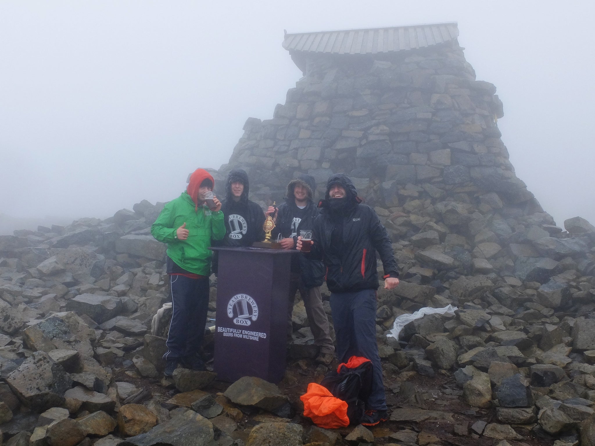 Dave Cooke, Harriet Allbrook and Oscar Price spent nearly four hours hauling the nine gallon cask of Tunnel Vision beer to the top of the mountain