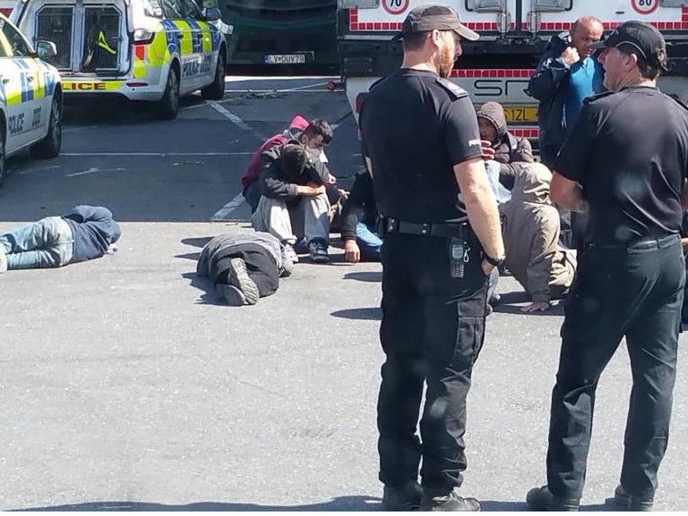 The Migrants wait in the services car park Twitter: @bigwheeluk