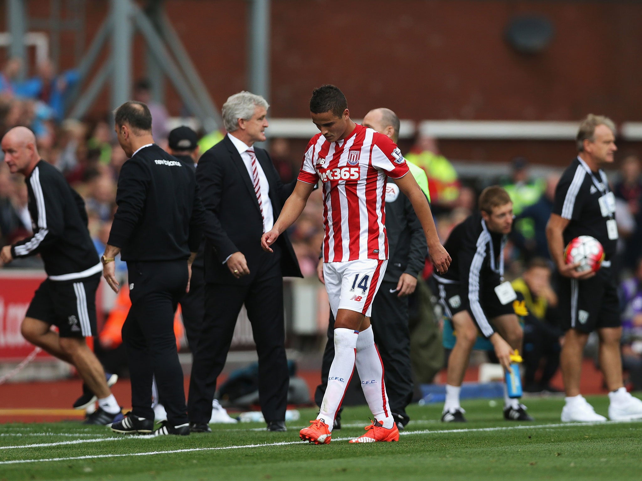 Ibrahim Afellay walks off the Britannia pitch after being shown a red card