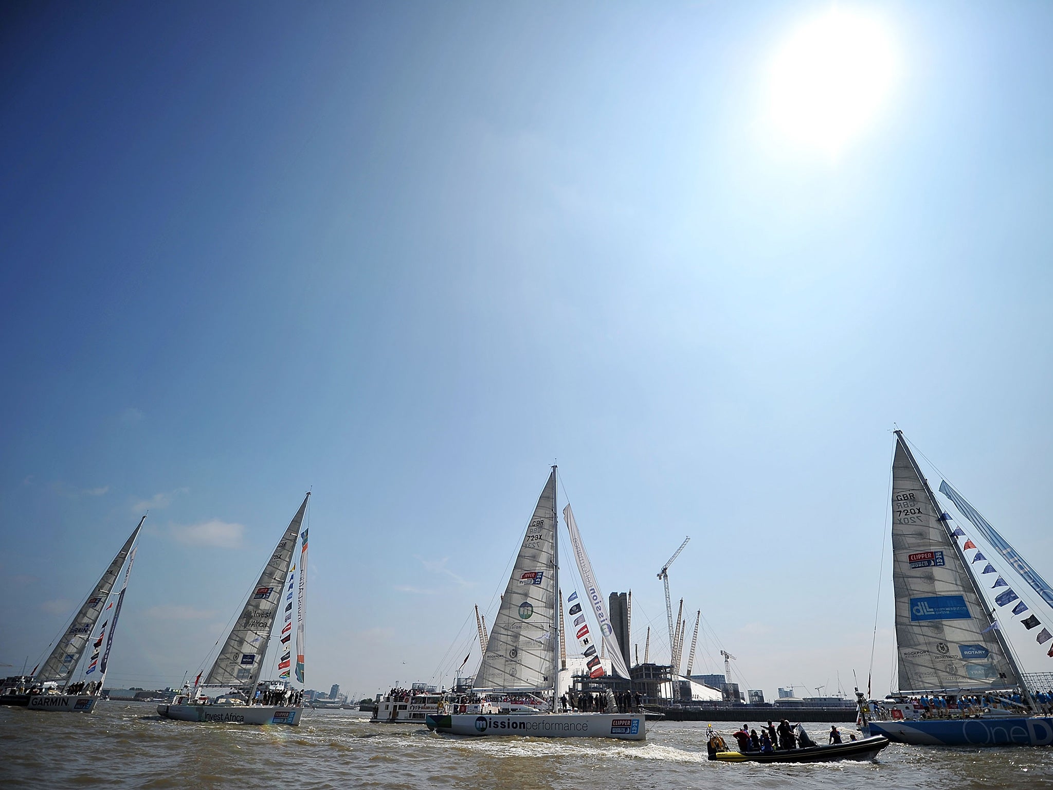 The Clipper Round the World yachts return to London in a victory parade, passing the O2 Arena on their way to moor at St Katharine's dock on July 12, 2014