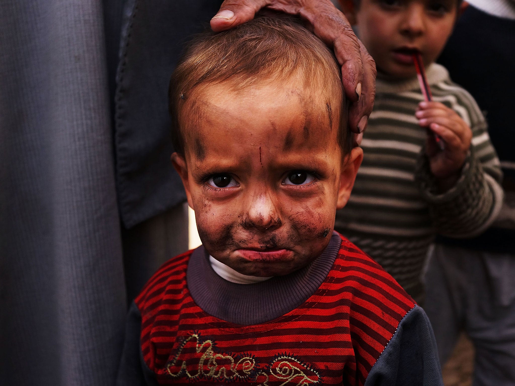 A displaced Syrian child is viewed in a makeshift camp for Syrian refugees only miles from the border with Syria in the Bekaa Valley