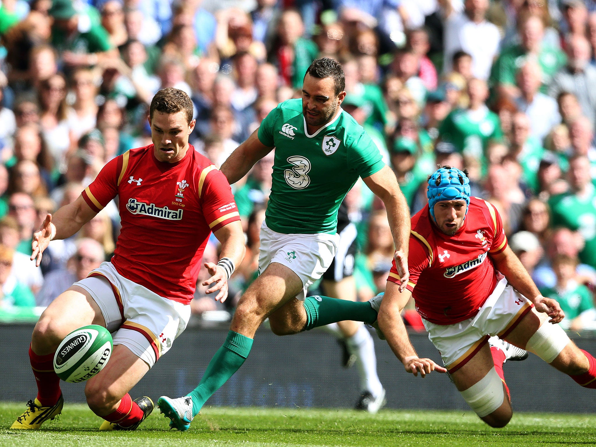 Wales’ George North, left, and Justin Tipuric battle for the ball with Ireland’s Dave Kearney in Dublin