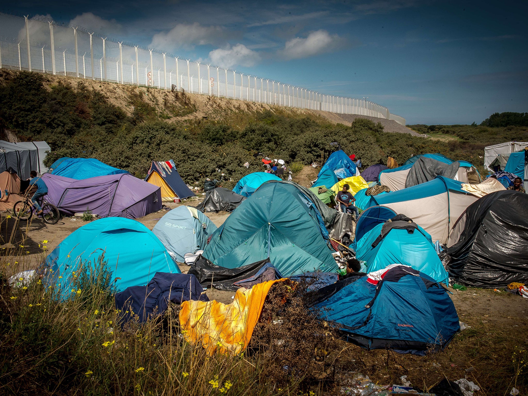 Makeshift shelters in dunes north of the French Channel port (AFP)