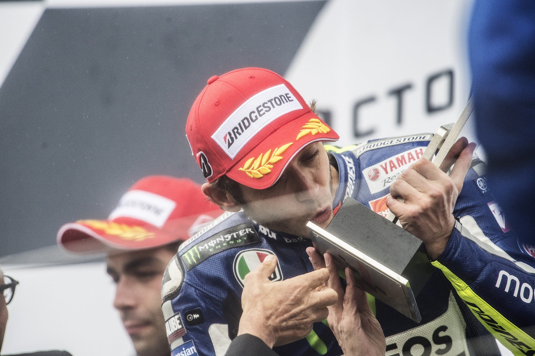 Valentino Rossi kisses his British Grand Prix trophy