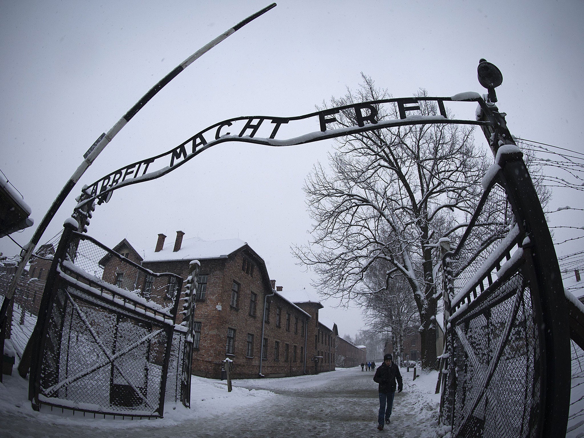 The lettering 'Arbeit macht frei' (work makes you free) at the entrance of the memorial site of the former Nazi concentration camp Auschwitz-Birkenau in Oswiecim, Poland.