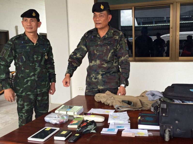 Soldiers displayed items seized by the Erawan Shrine bombing suspect arrested near the Cambodian border