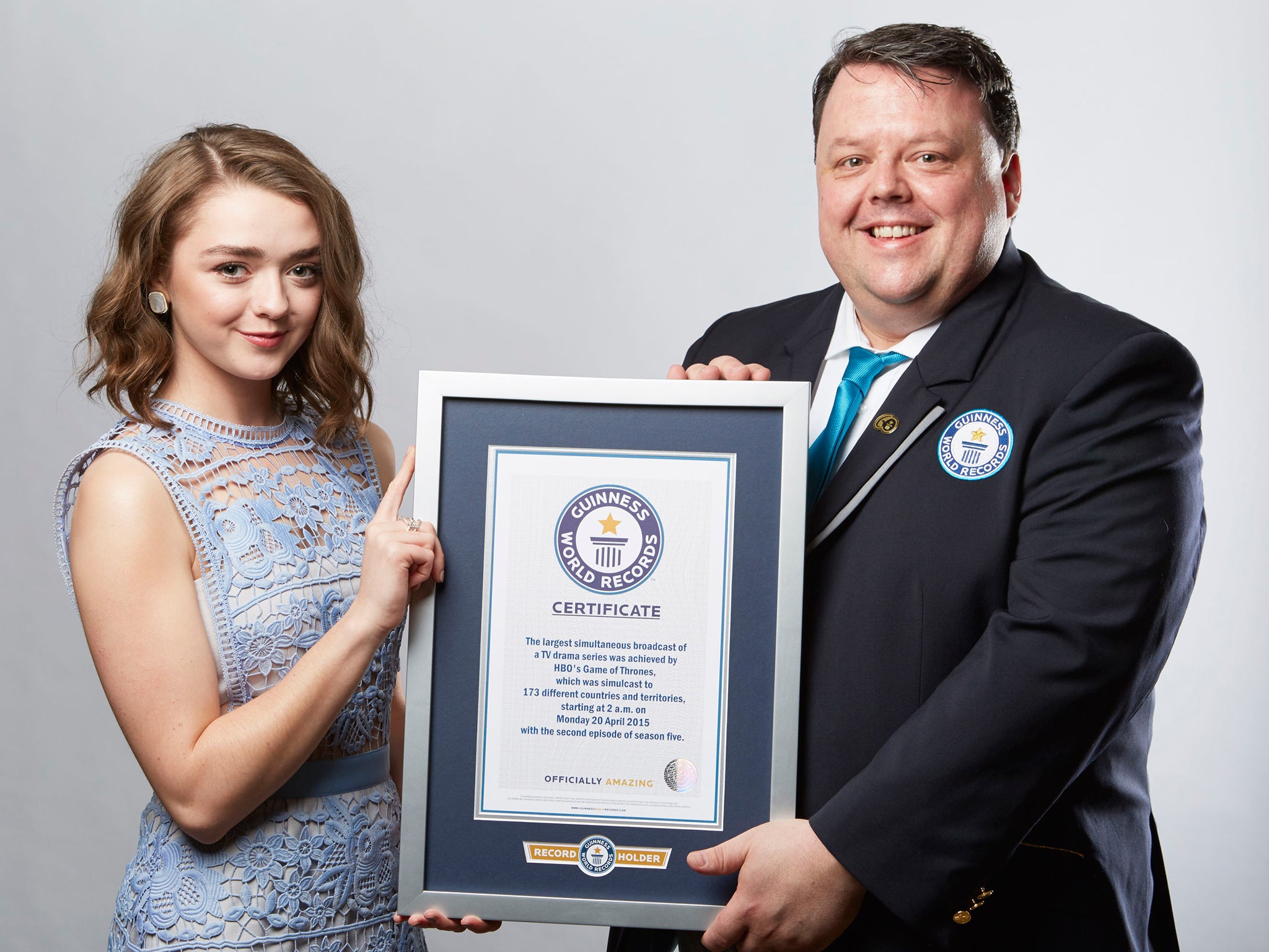 Maisie Williams picks up an award on behalf of the show after it made the Guinness Book of Records for the largest TV drama simulcast