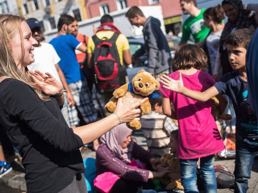 Volunteers, police, the emergency services and council employees greeted the new arrivals