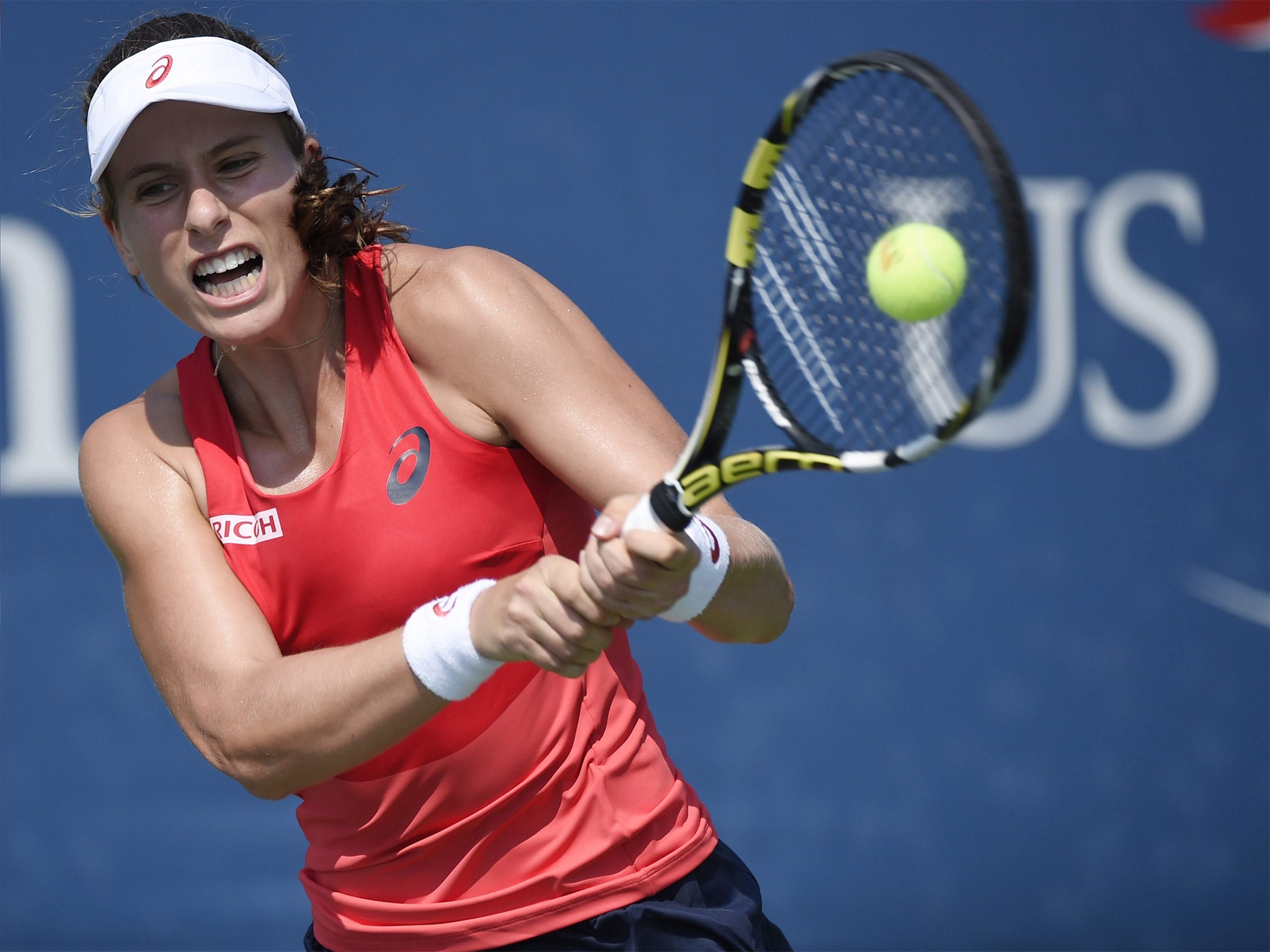 Johanna Konta hits a return during her victory