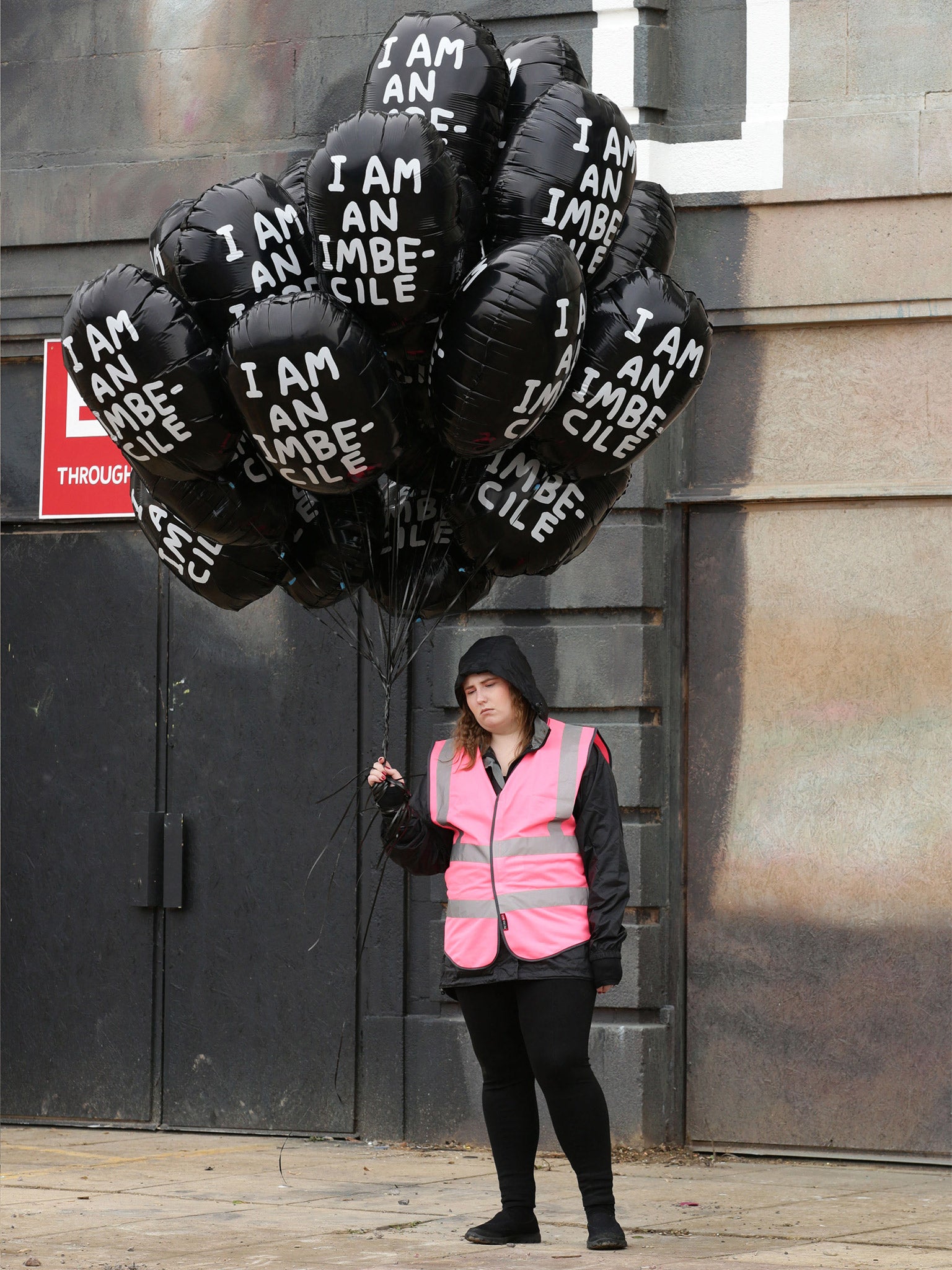 A guide at Dismaland - which is designed to ‘bemuse’ rather than amuse