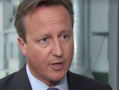 David Cameron announced the UK will take in 'thousands more' Syrian refugees on an official visit to Portugal