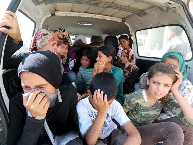 Relatives of the Kurdi family mourning in Kobani