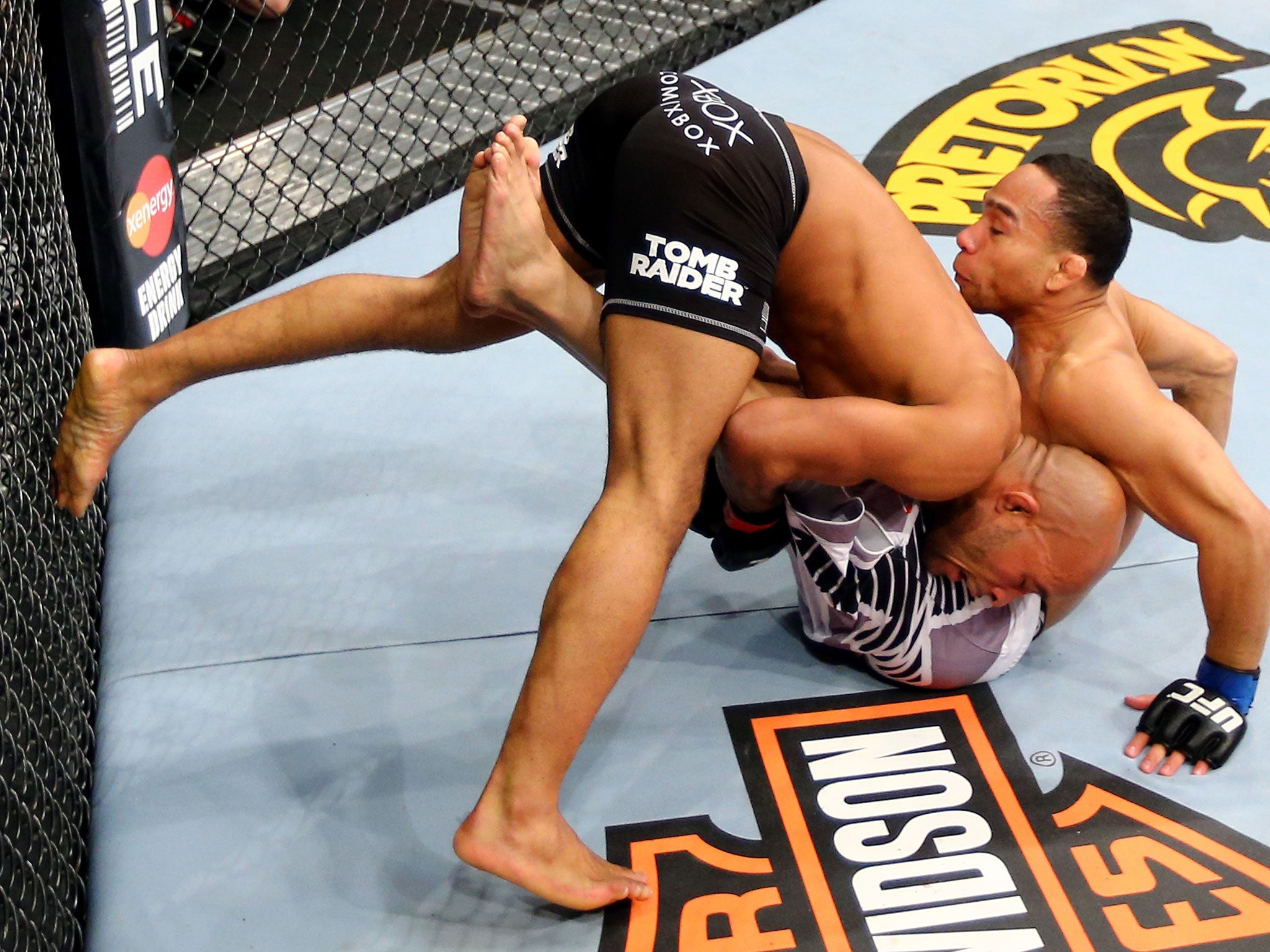 Demetrious Johnson (L) dumps John Dodson (R) during their Flyweight Championship bout