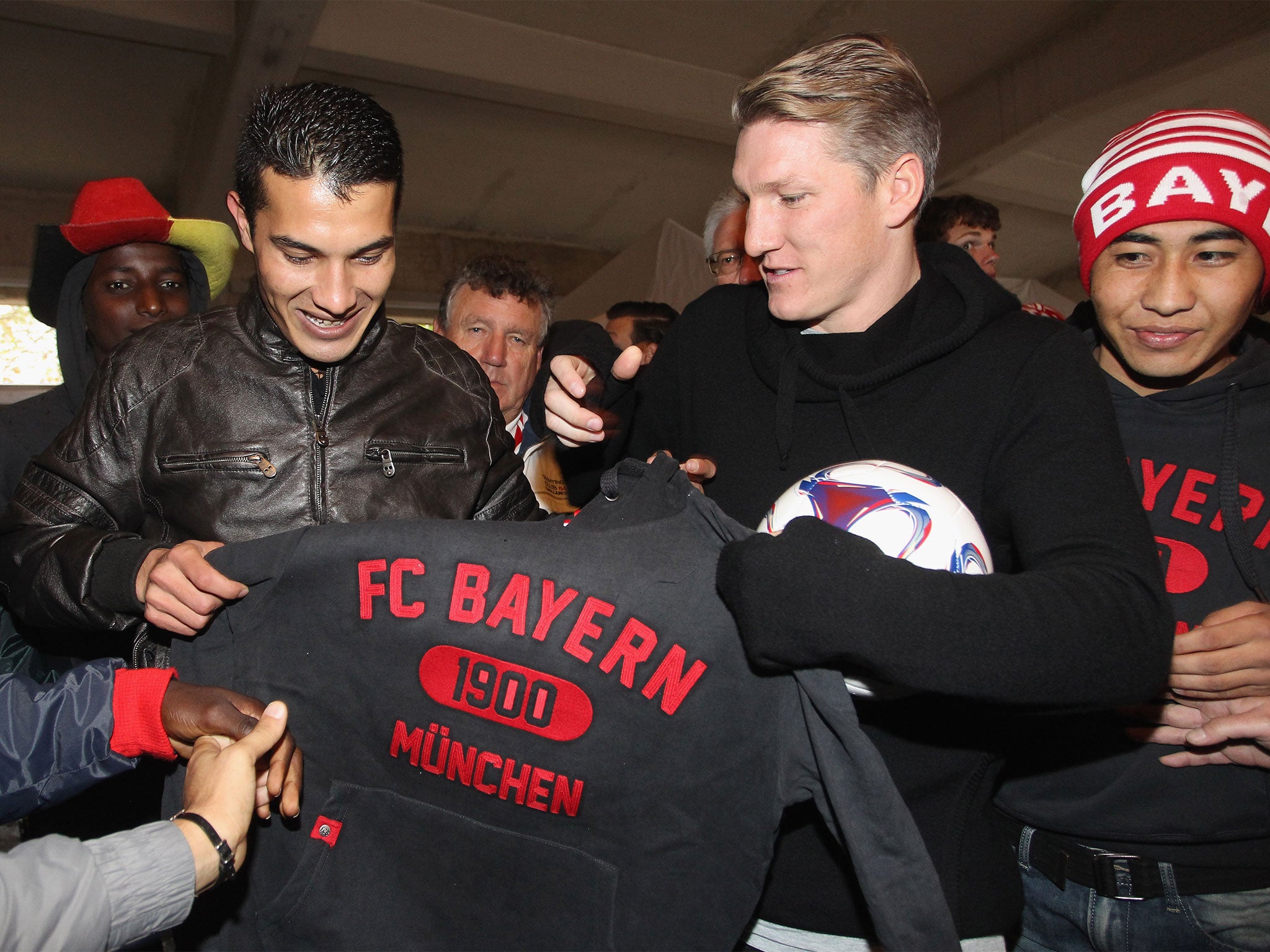 The former Bayern midfielder Bastian Schweinsteiger donates kit to refugees