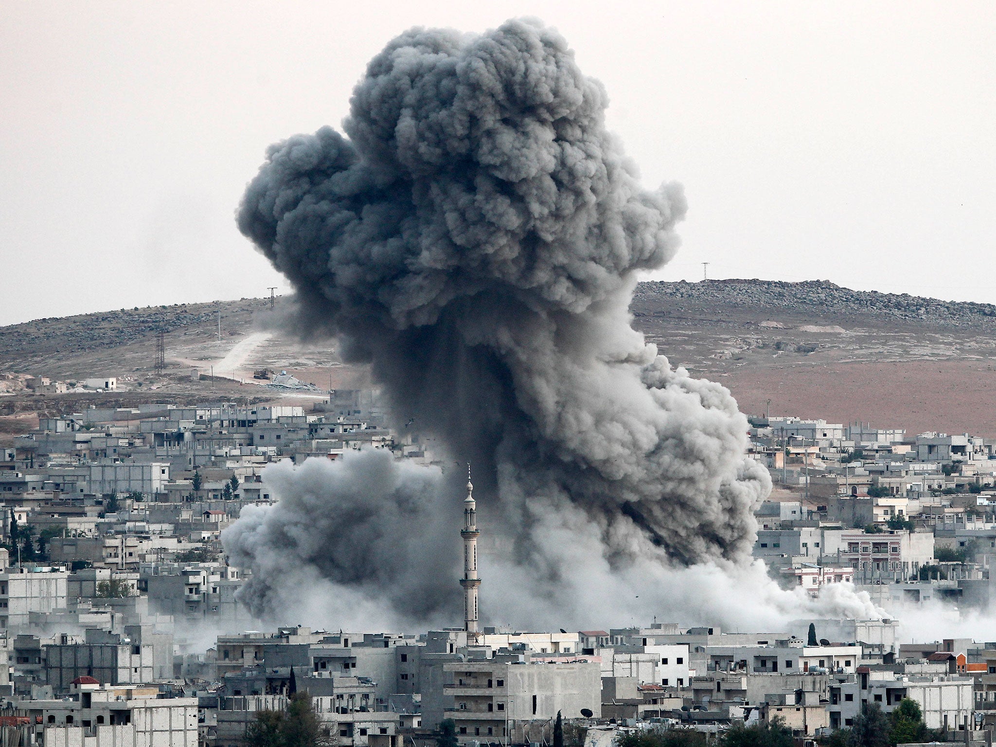 Heavy smoke rises following an airstrike by the US-led coalition aircraft in Kobane, Syria